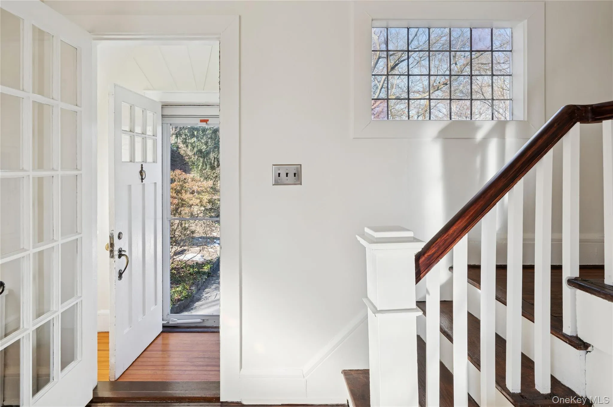 Staircase with wood finished floors and baseboards Staircase with wood finished floors and baseboards