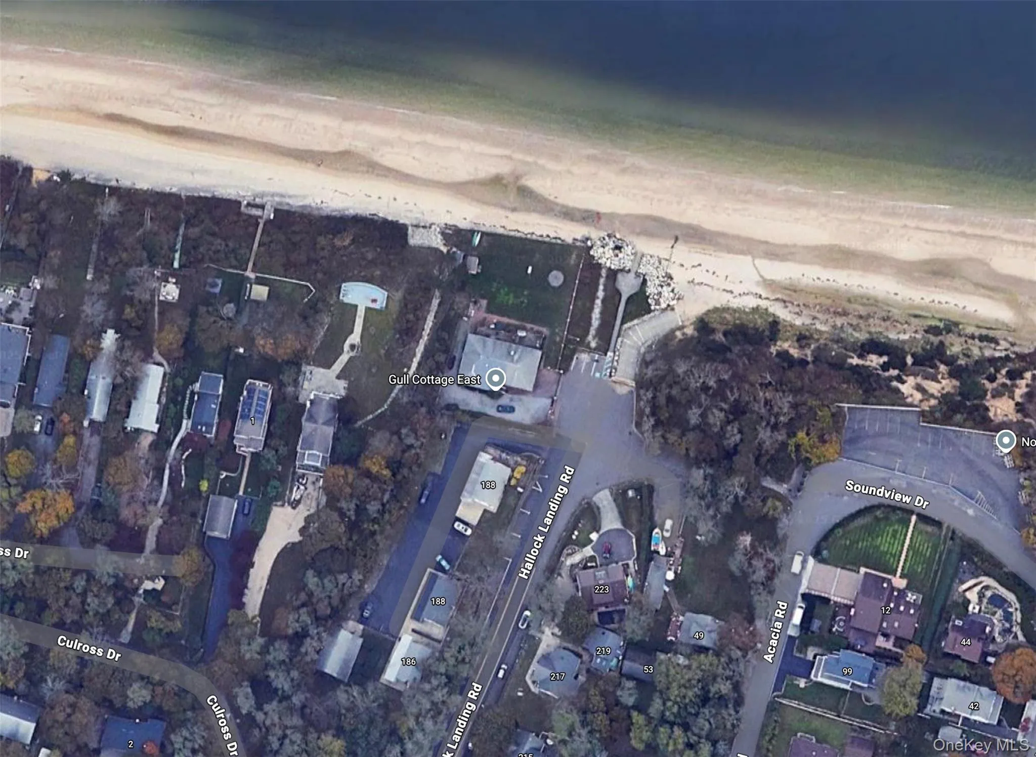 Aerial overview of property's location featuring local beach Aerial overview of property's location featuring local beach