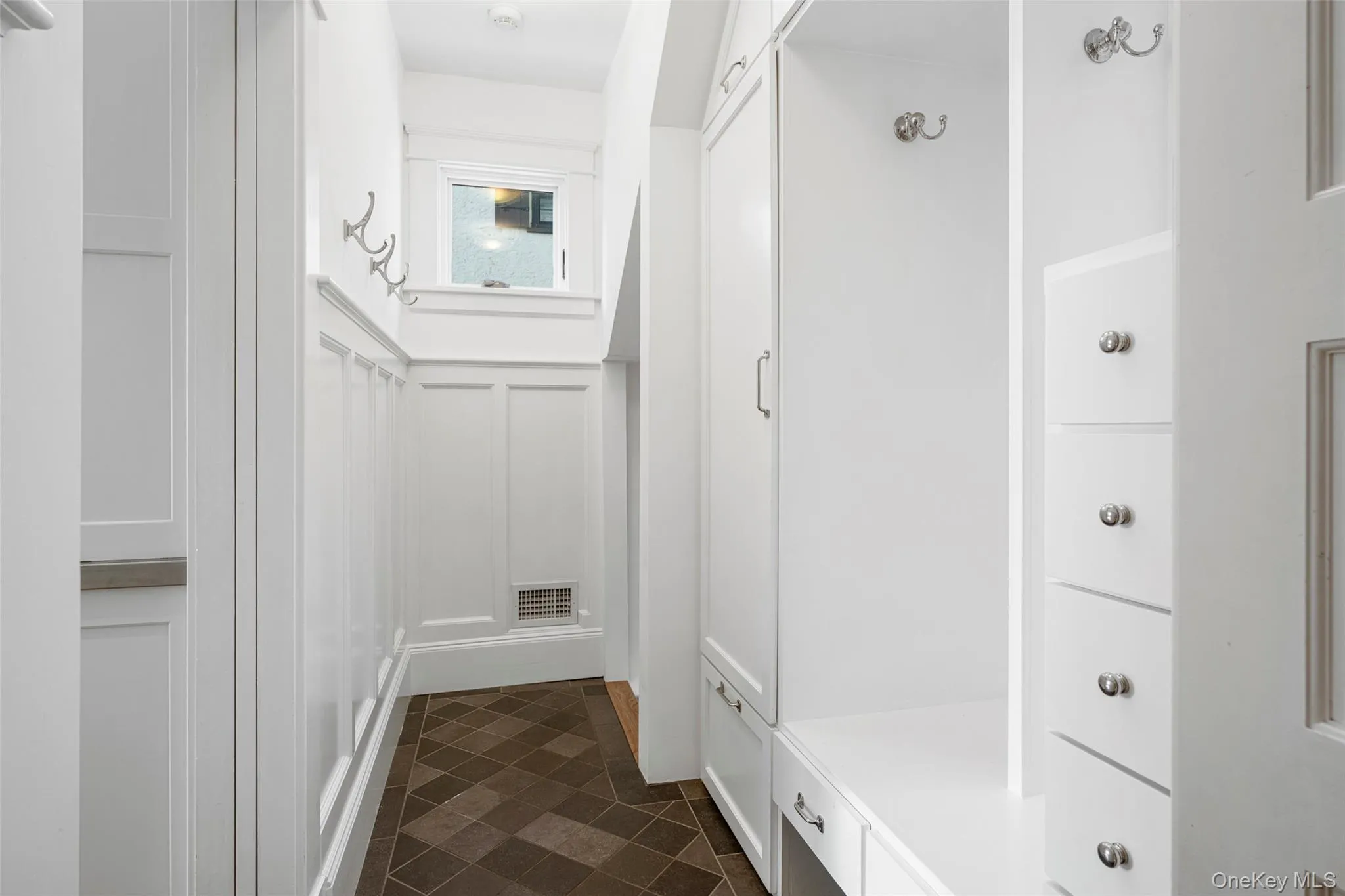 Mudroom to catch backpacks and shoes Mudroom to catch backpacks and shoes