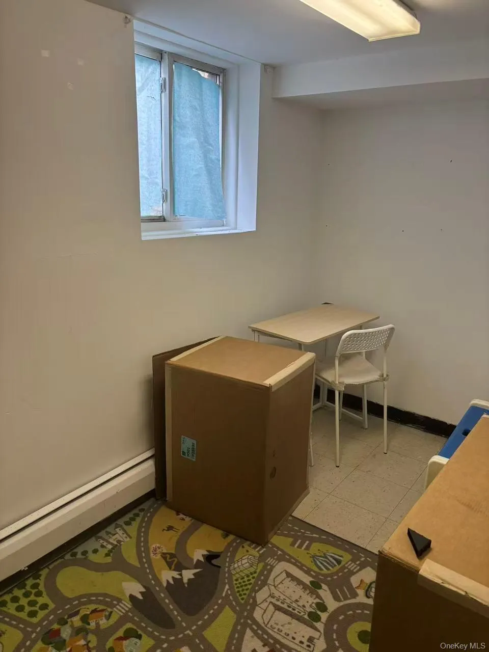 Home office with a baseboard heating unit and baseboards Home office with a baseboard heating unit and baseboards