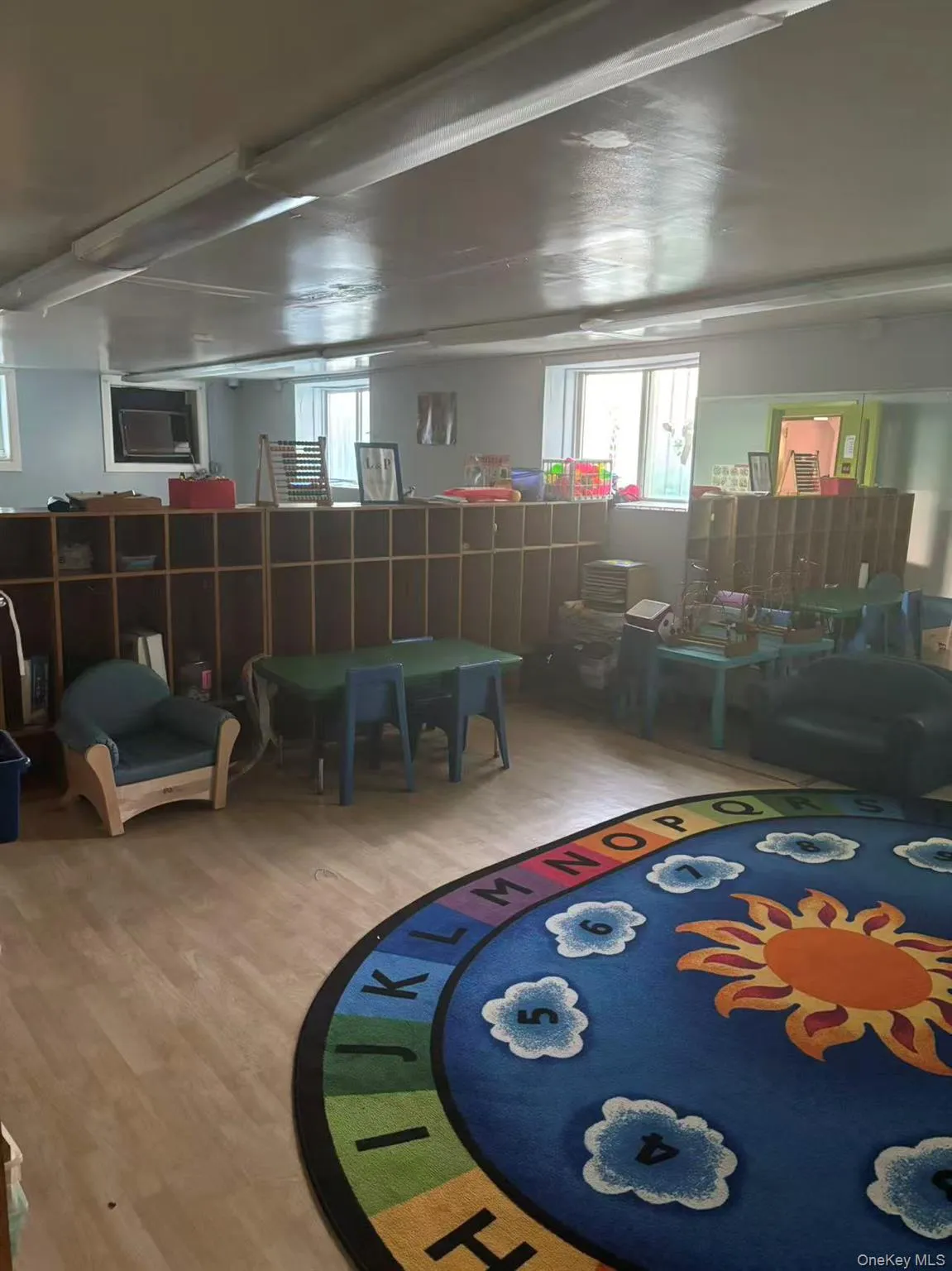 Rec room with healthy amount of natural light and wood finished floors Rec room with healthy amount of natural light and wood finished floors