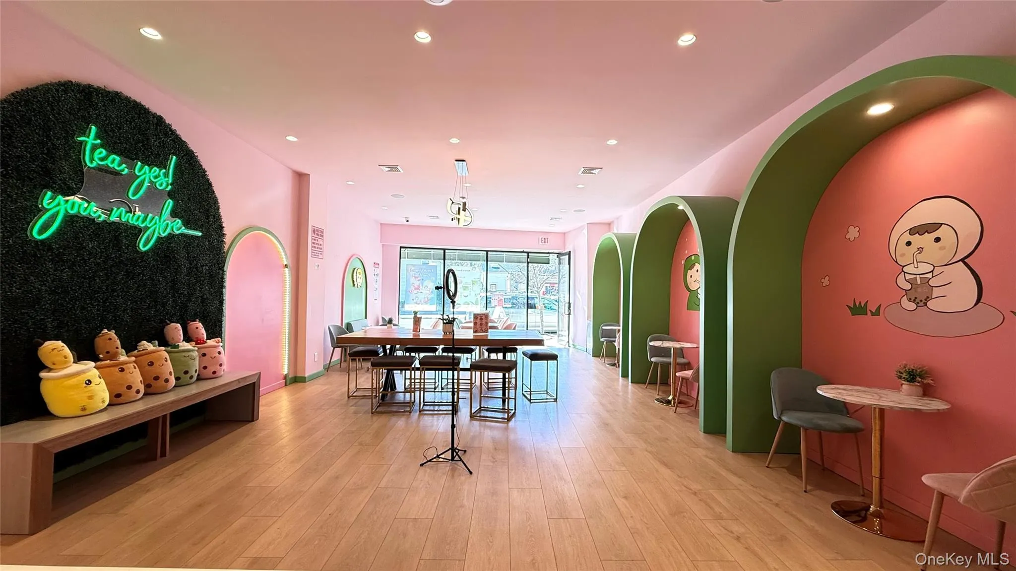 Dining space with recessed lighting, arched walkways, baseboards, and light wood-type flooring Dining space with recessed lighting, arched walkways, baseboards, and light wood-type flooring