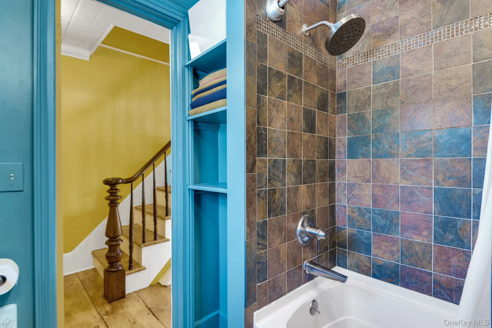 Tiled shower/tub. Tiled shower/tub.