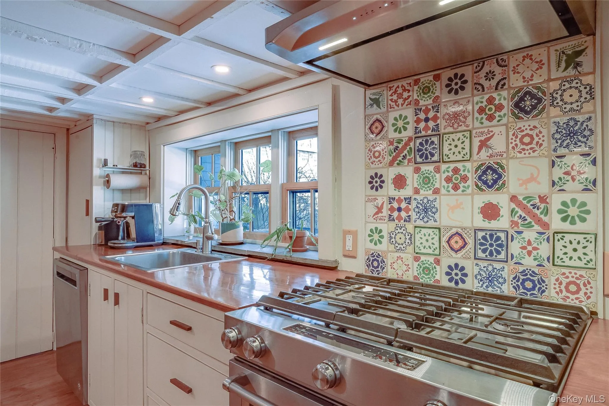 Kitchen with commercial grade gas stove. Kitchen with commercial grade gas stove.