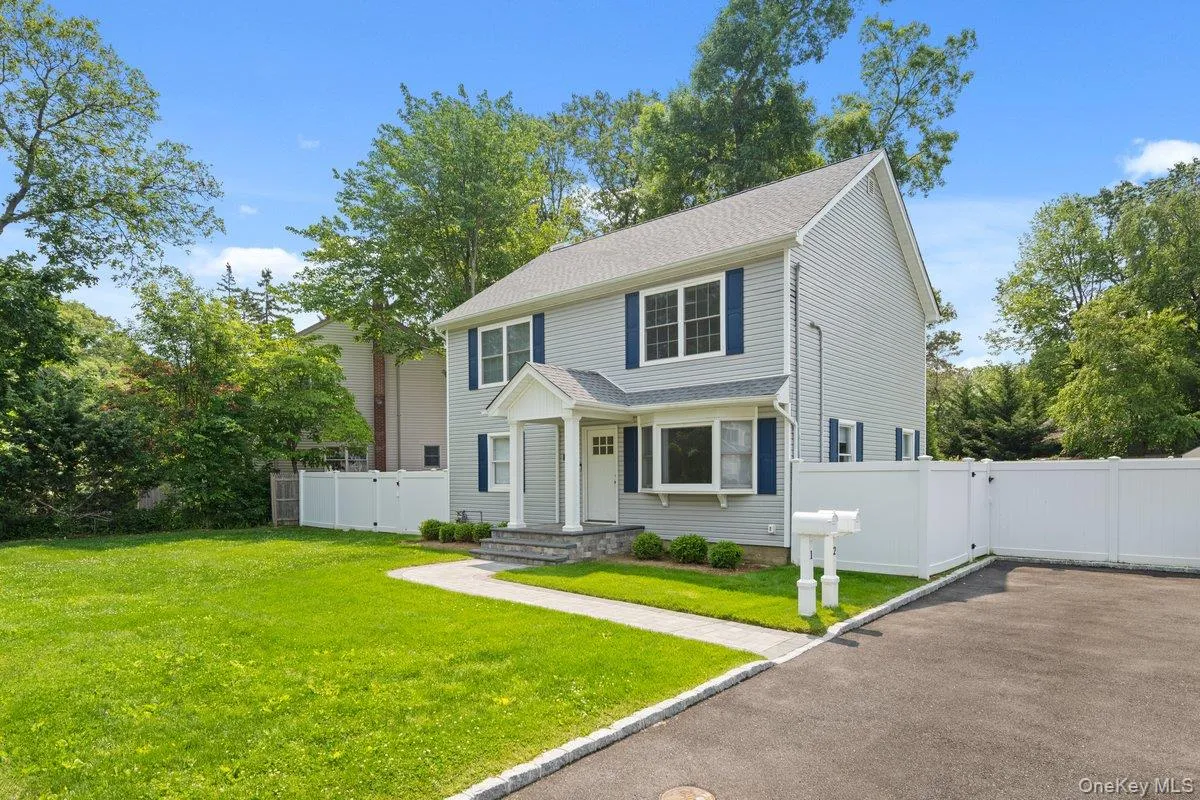 View of front of house featuring a gate and a shingled roof View of front of house featuring a gate and a shingled roof