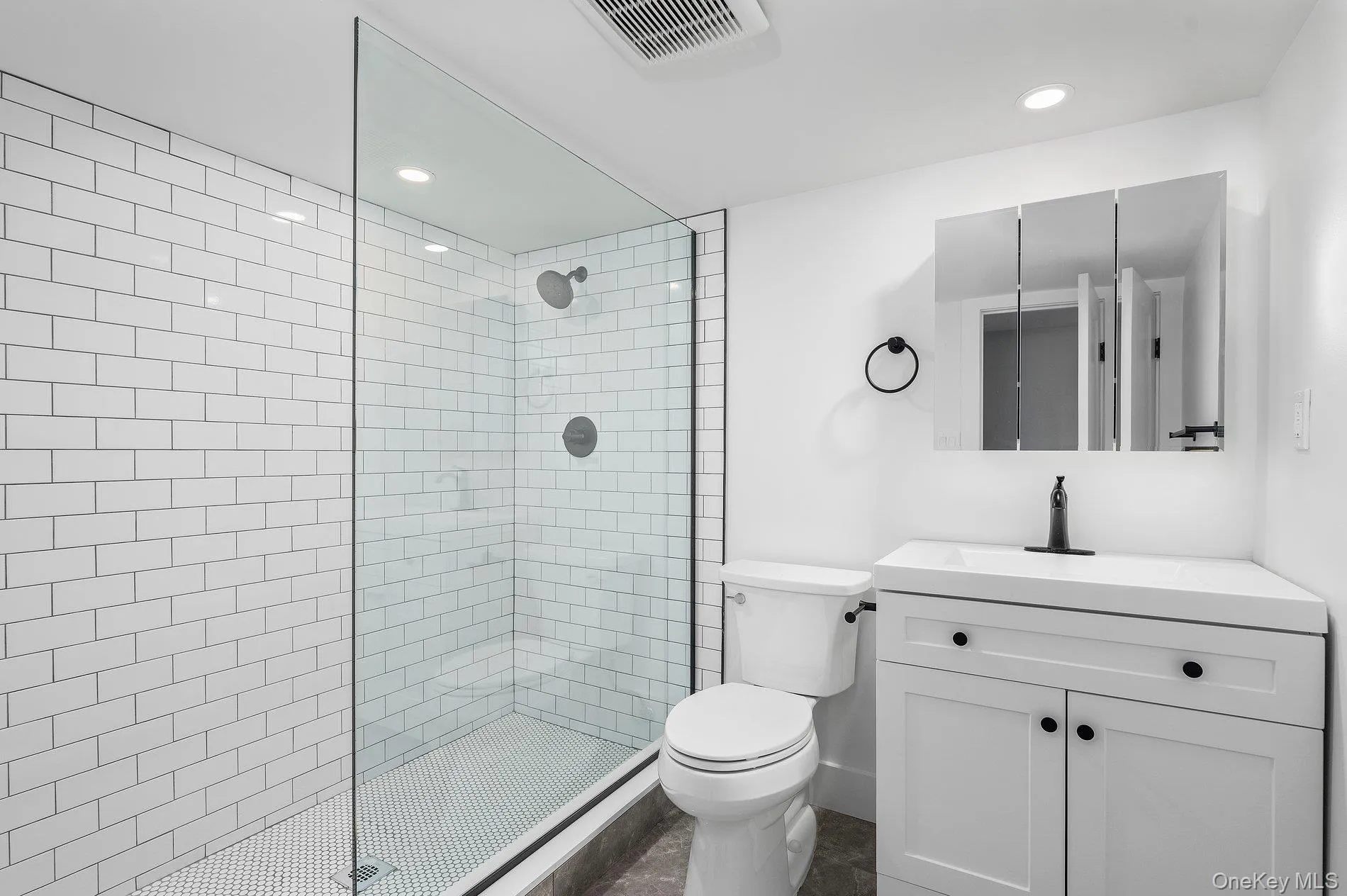 Full bath with a walk in shower, vanity, and recessed lighting Full bath with a walk in shower, vanity, and recessed lighting