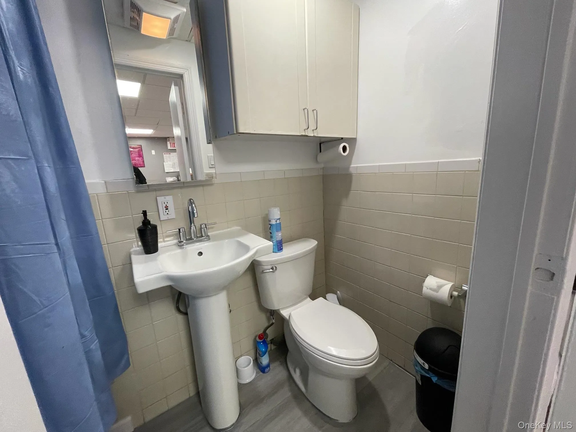 Bathroom with tile walls and wainscoting Bathroom with tile walls and wainscoting