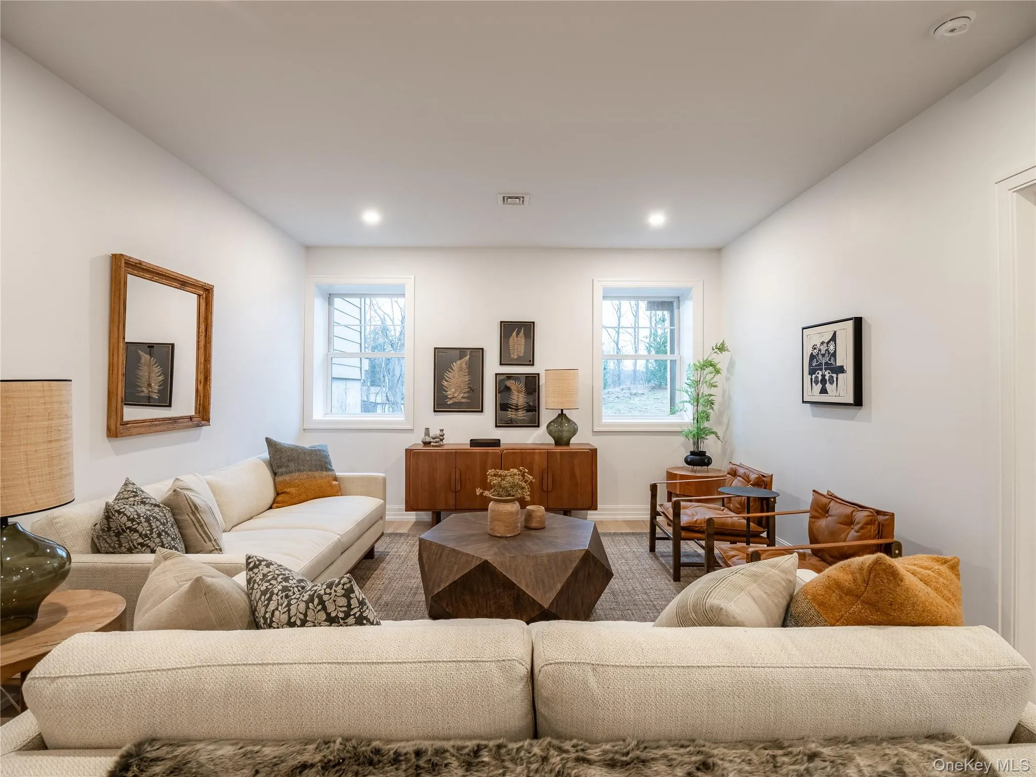 Living room with recessed lighting and wood finished floors Living room with recessed lighting and wood finished floors