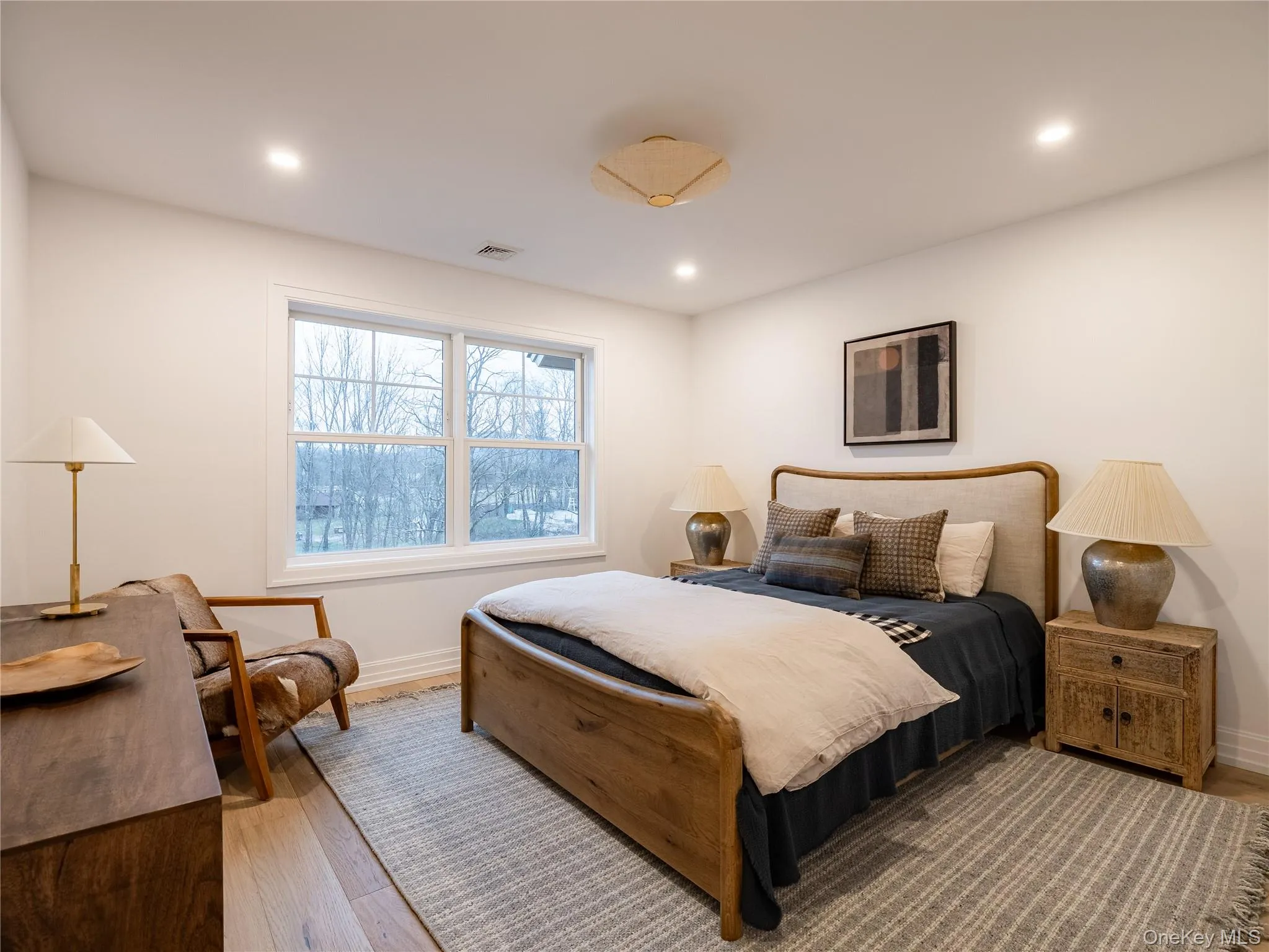 Bedroom with hardwood / wood-style floors and recessed lighting Bedroom with hardwood / wood-style floors and recessed lighting