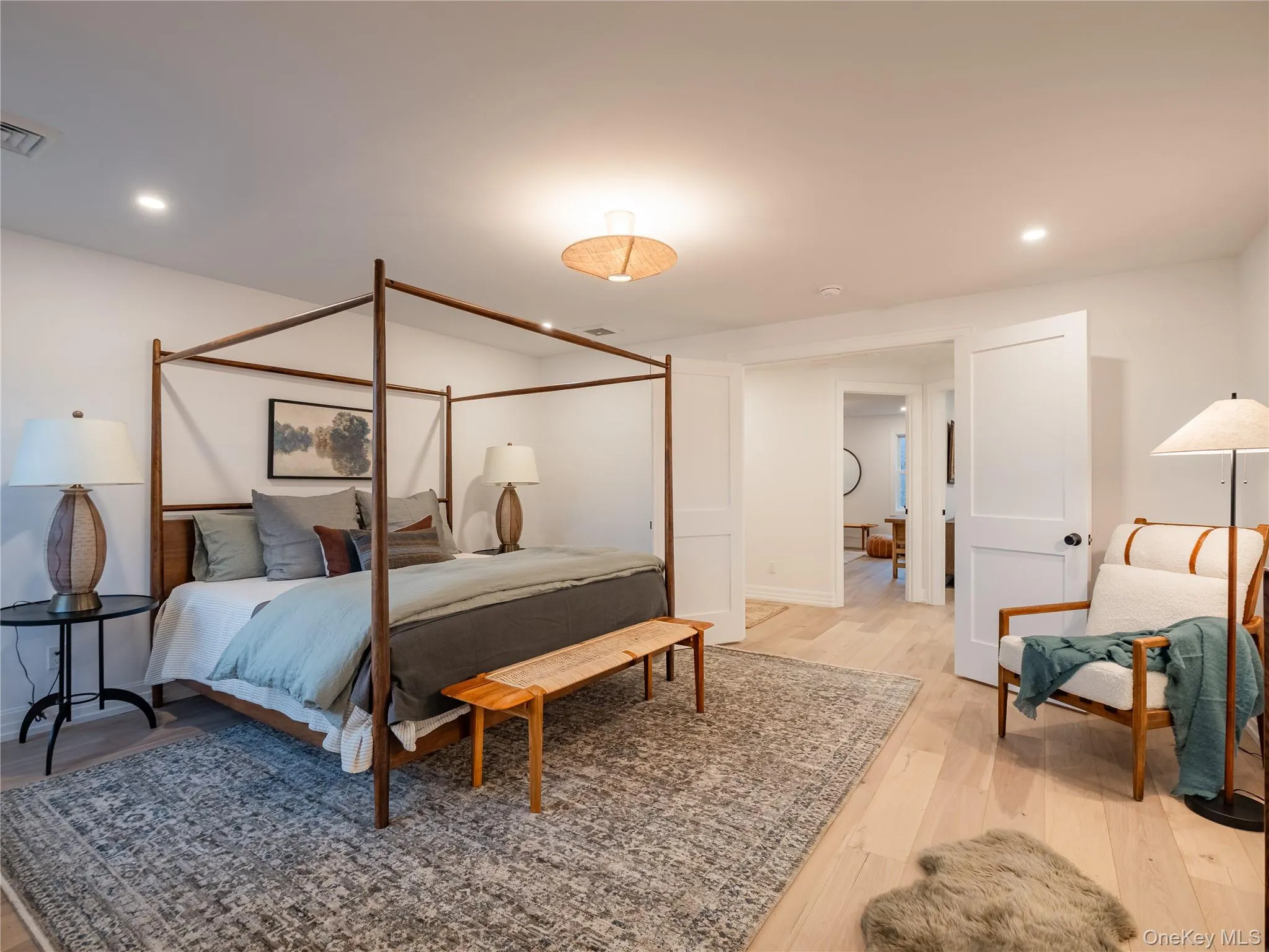 Bedroom featuring recessed lighting and light wood-style flooring Bedroom featuring recessed lighting and light wood-style flooring