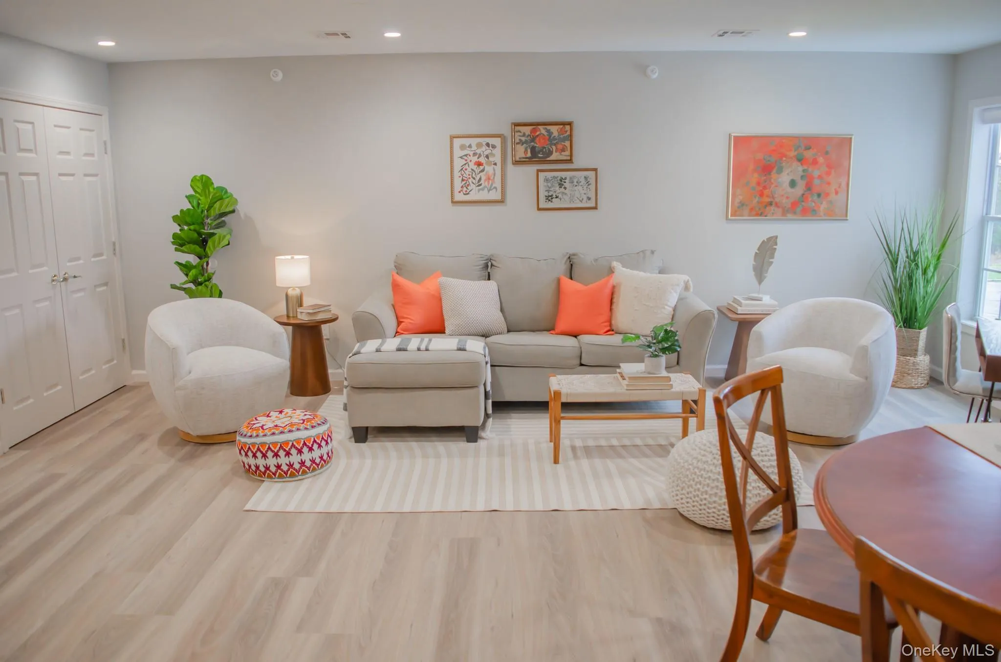 Living area with recessed lighting and light wood-style floors Living area with recessed lighting and light wood-style floors