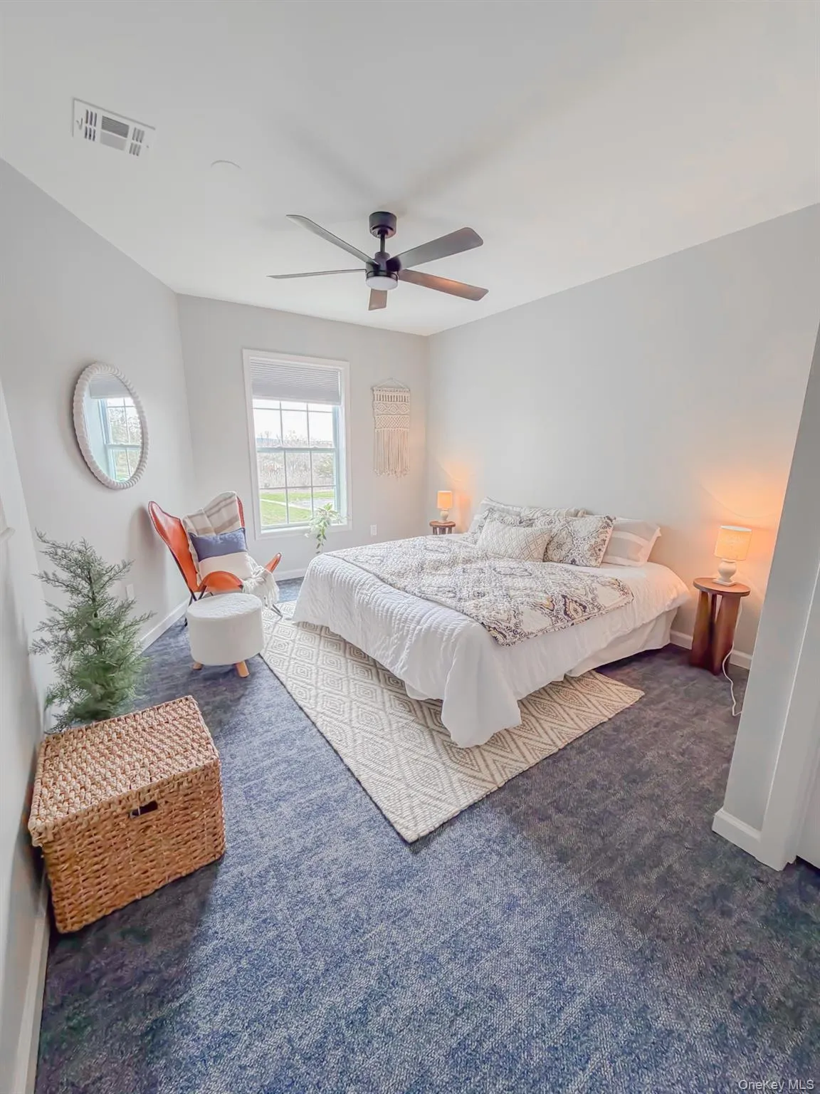 Bedroom featuring dark carpet and ceiling fan Bedroom featuring dark carpet and ceiling fan