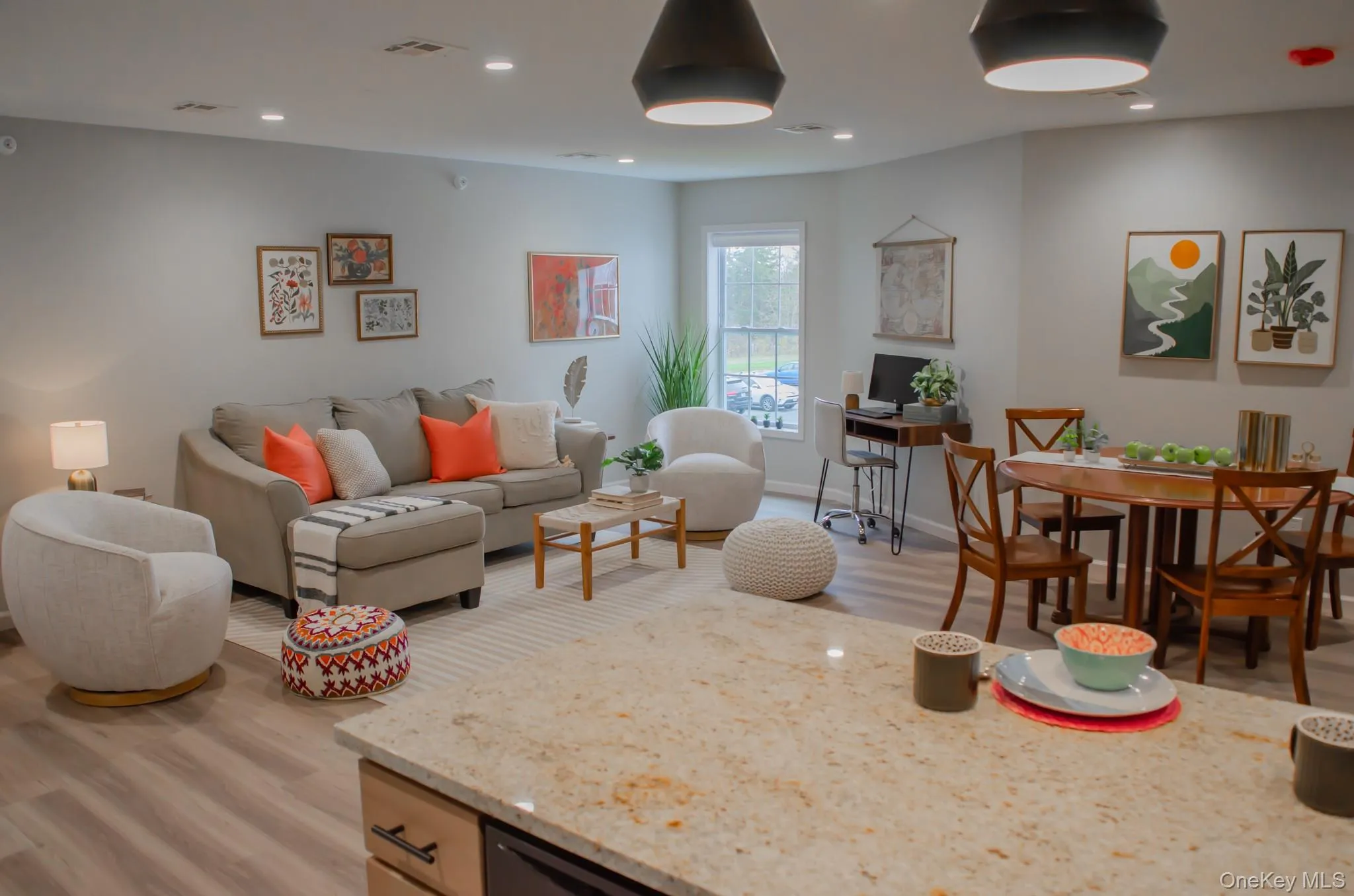 Living area featuring light wood-style floors and recessed lighting Living area featuring light wood-style floors and recessed lighting