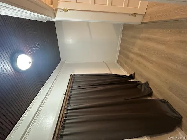 Empty room with light wood-style floors and baseboards Empty room with light wood-style floors and baseboards