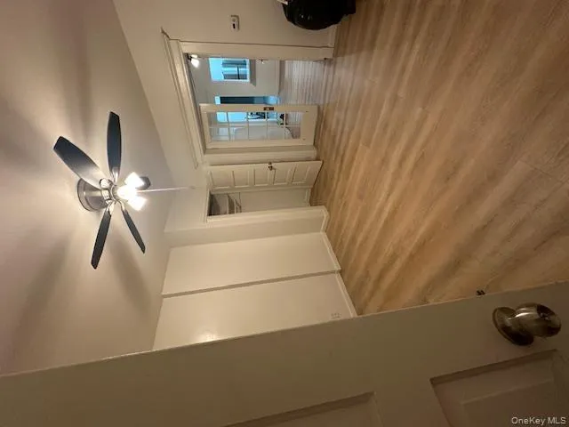 Unfurnished bedroom featuring light wood-style floors, ceiling fan, french doors, and a closet Unfurnished bedroom featuring light wood-style floors, ceiling fan, french doors, and a closet