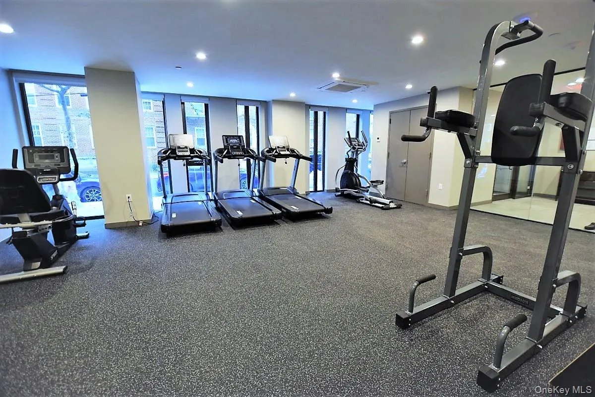 Exercise room with recessed lighting and cooling unit Exercise room with recessed lighting and cooling unit