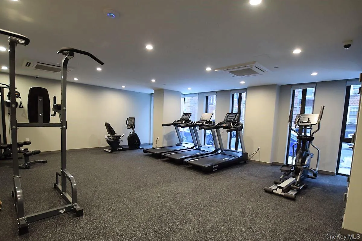 Workout area with recessed lighting and cooling unit Workout area with recessed lighting and cooling unit