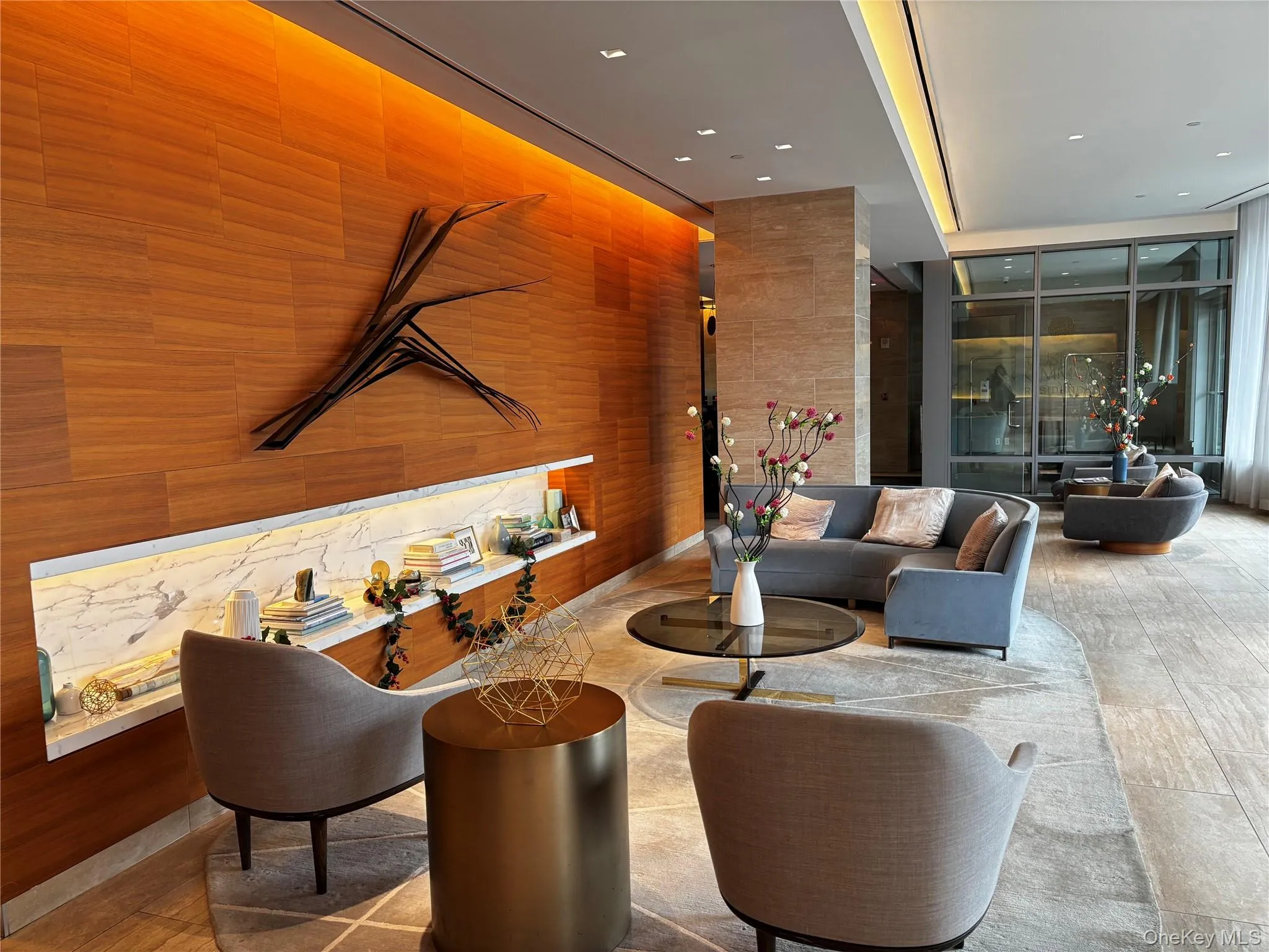 Building lobby with a wall of windows and wood walls Building lobby with a wall of windows and wood walls