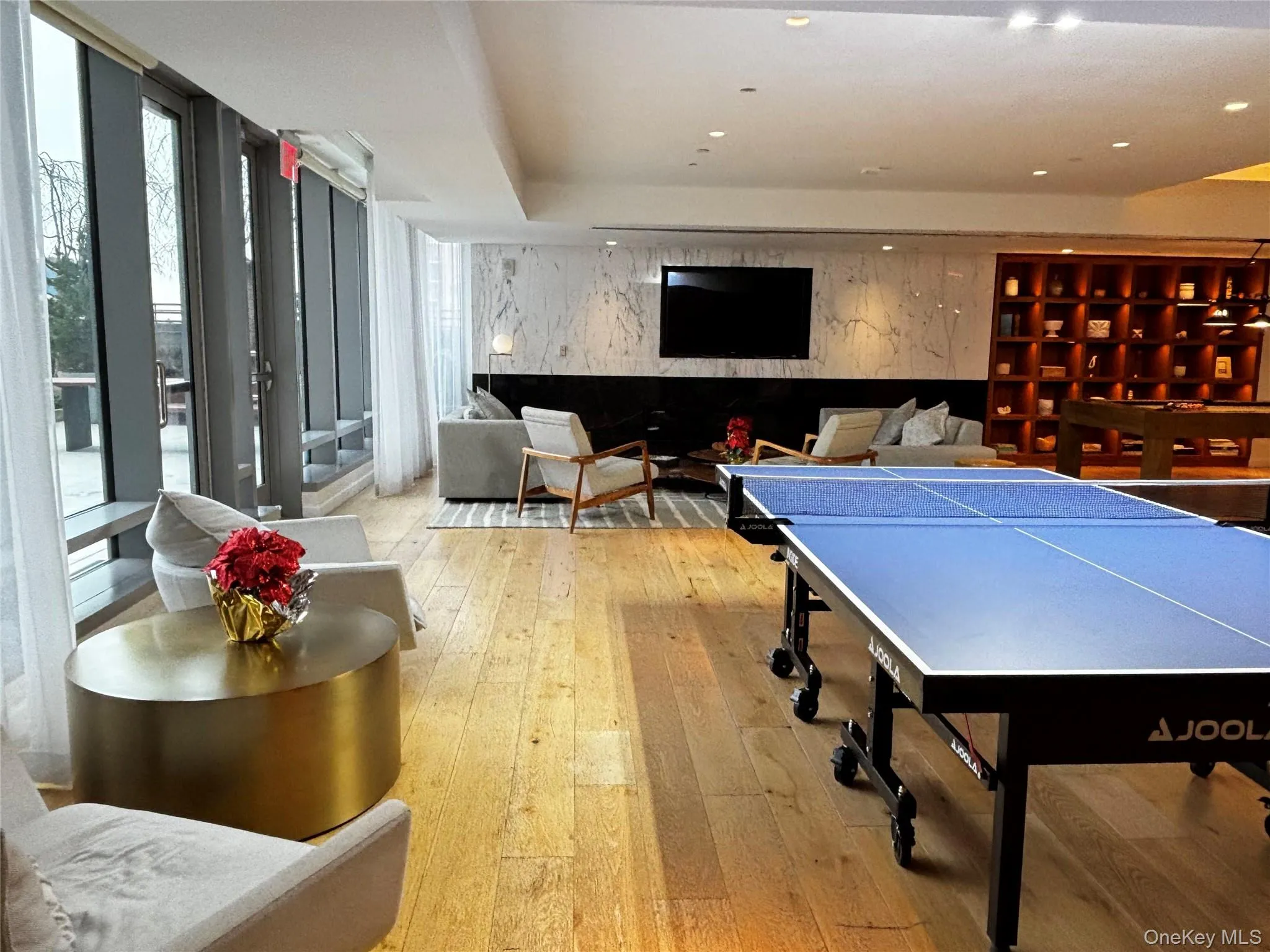 Game room with floor to ceiling windows Game room with floor to ceiling windows