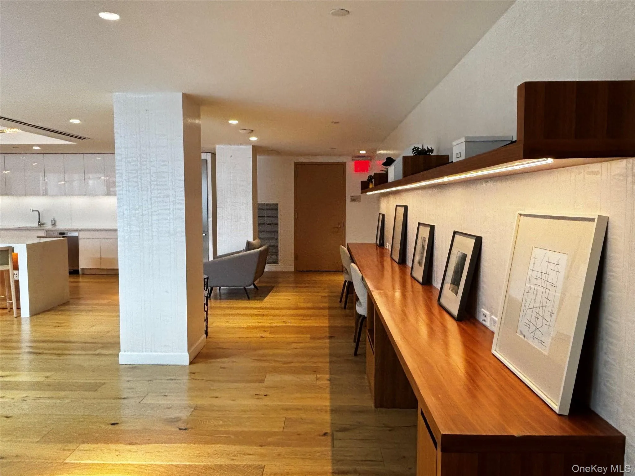 Hall with light wood-style flooring and recessed lighting Hall with light wood-style flooring and recessed lighting