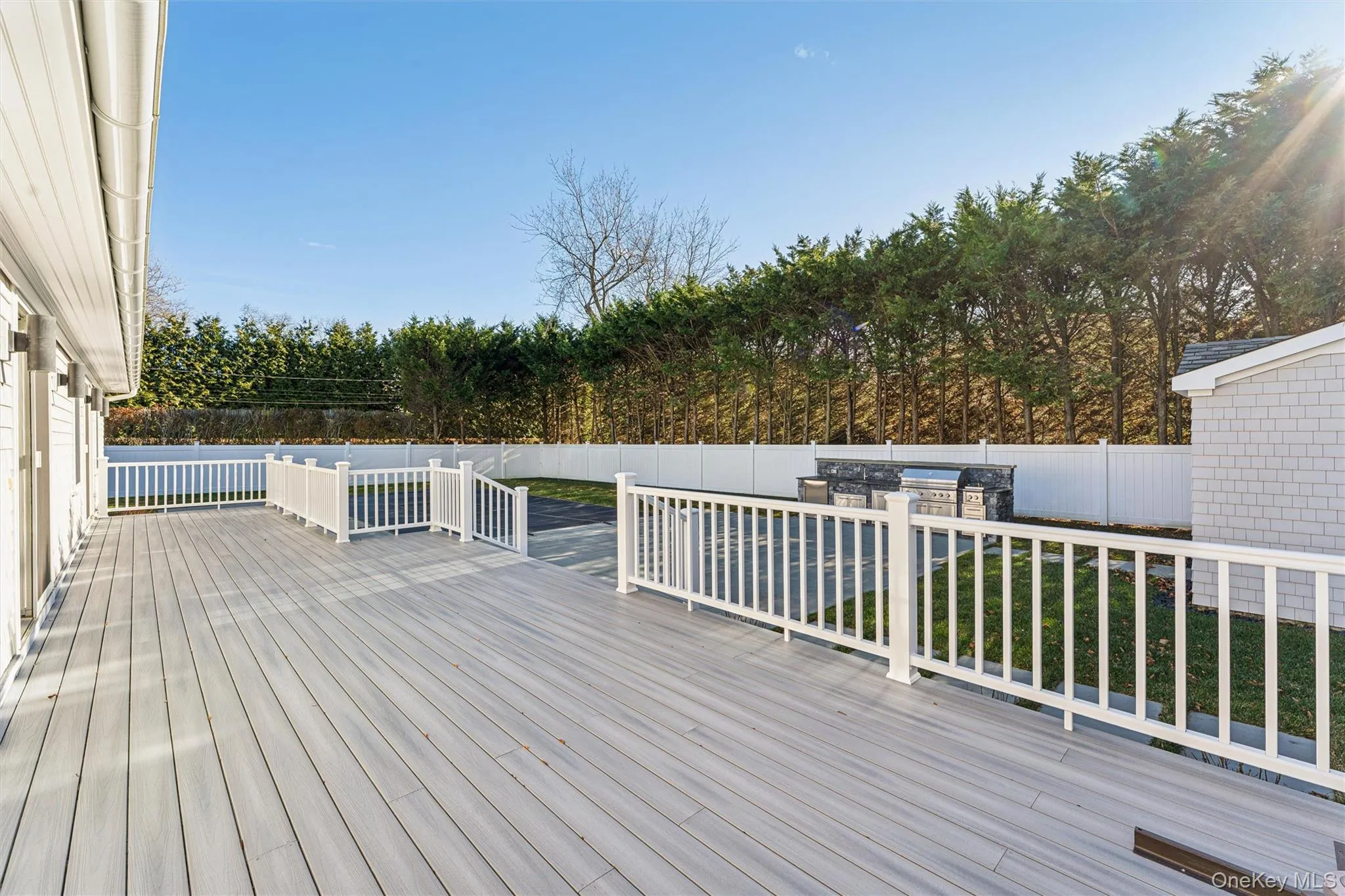 View of backyard deck off back sliding doors. View of backyard deck off back sliding doors.