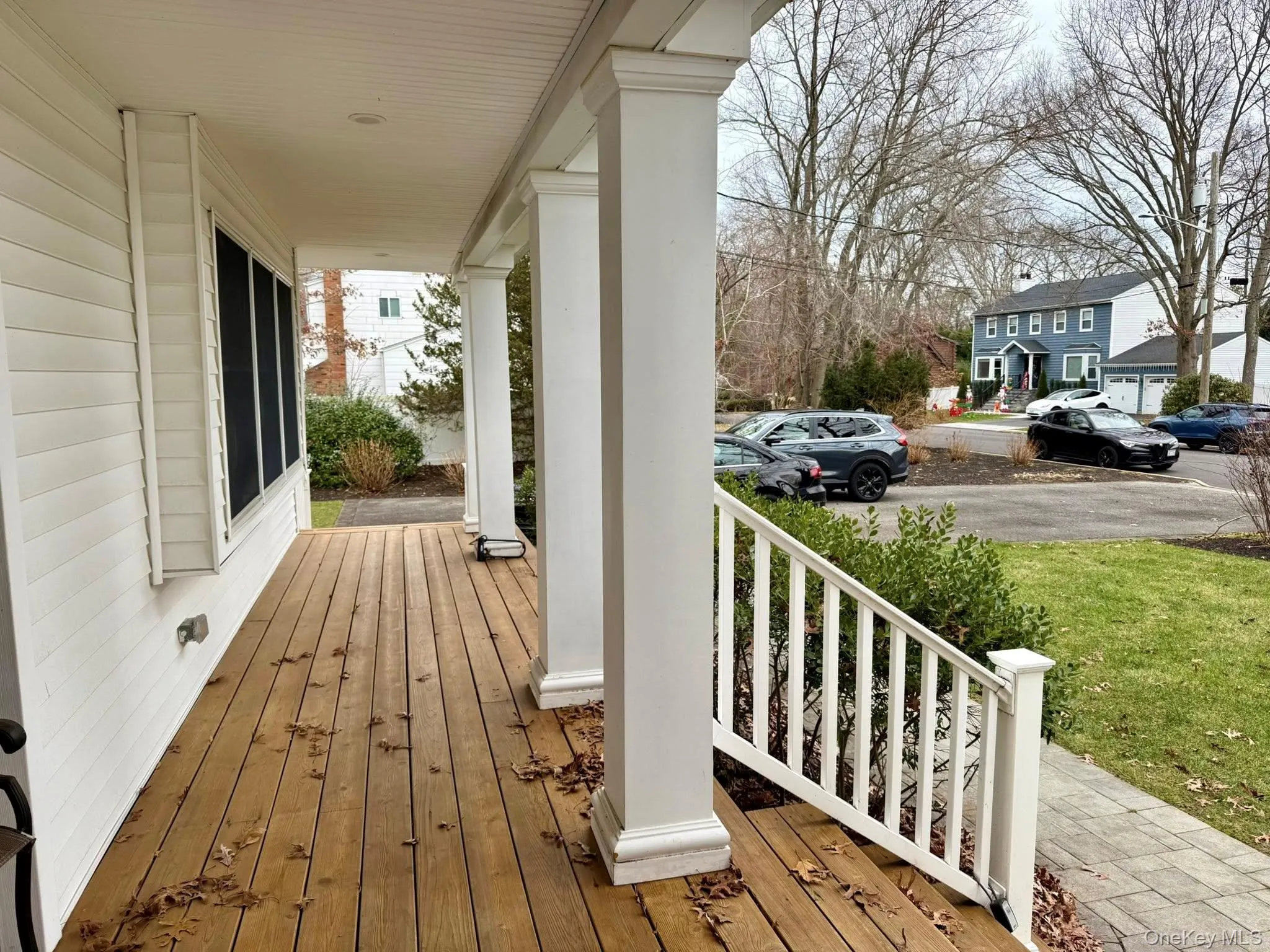 Wooden porch featuring a residential view Wooden porch featuring a residential view