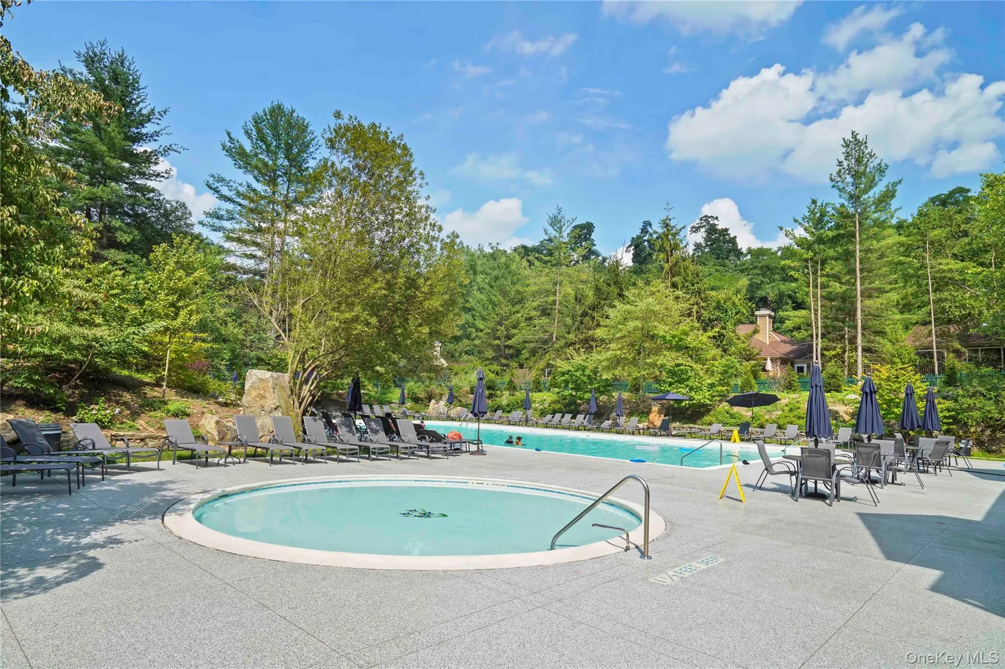 Community pool featuring a patio area Community pool featuring a patio area