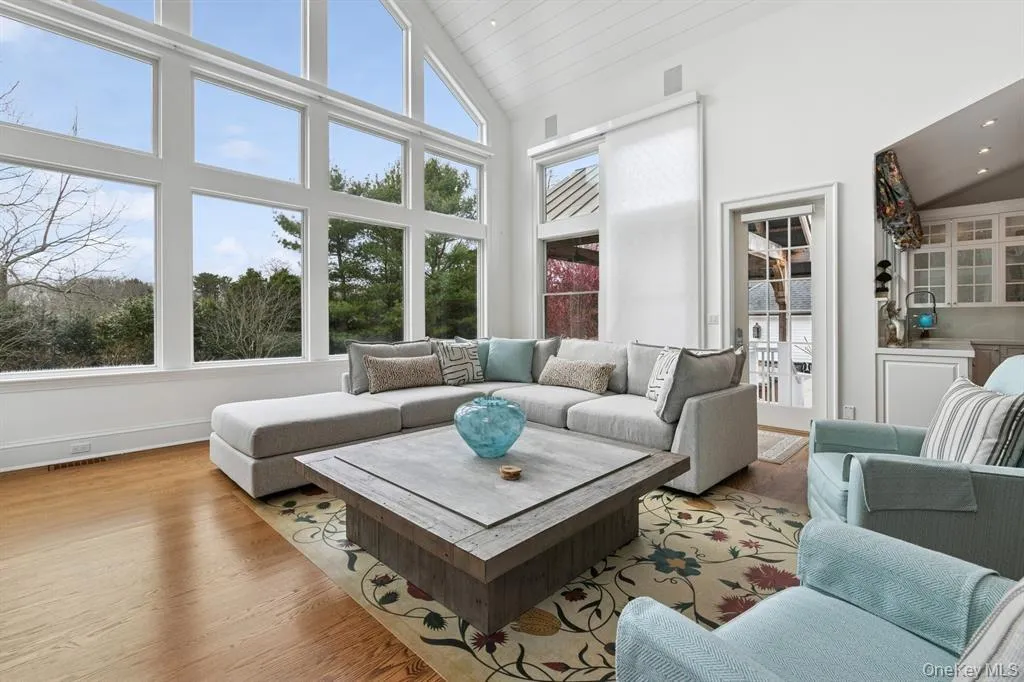 Sunroom featuring lofted ceiling Sunroom featuring lofted ceiling