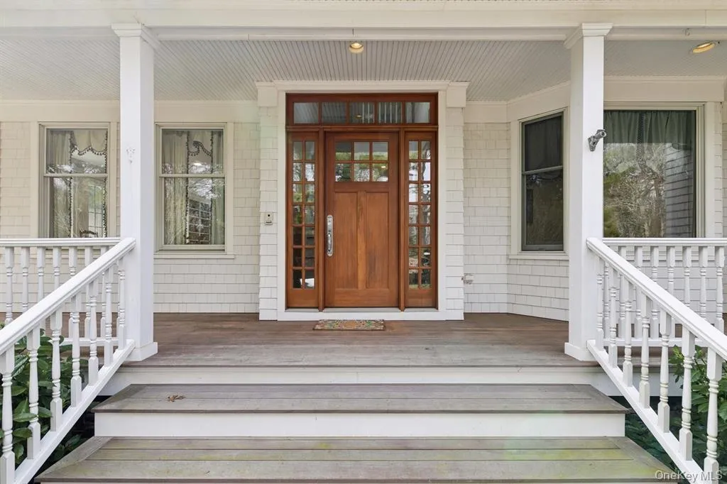 View of exterior entry with a porch View of exterior entry with a porch