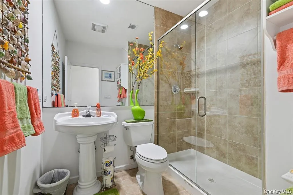 Bathroom featuring a shower stall and recessed lighting Bathroom featuring a shower stall and recessed lighting