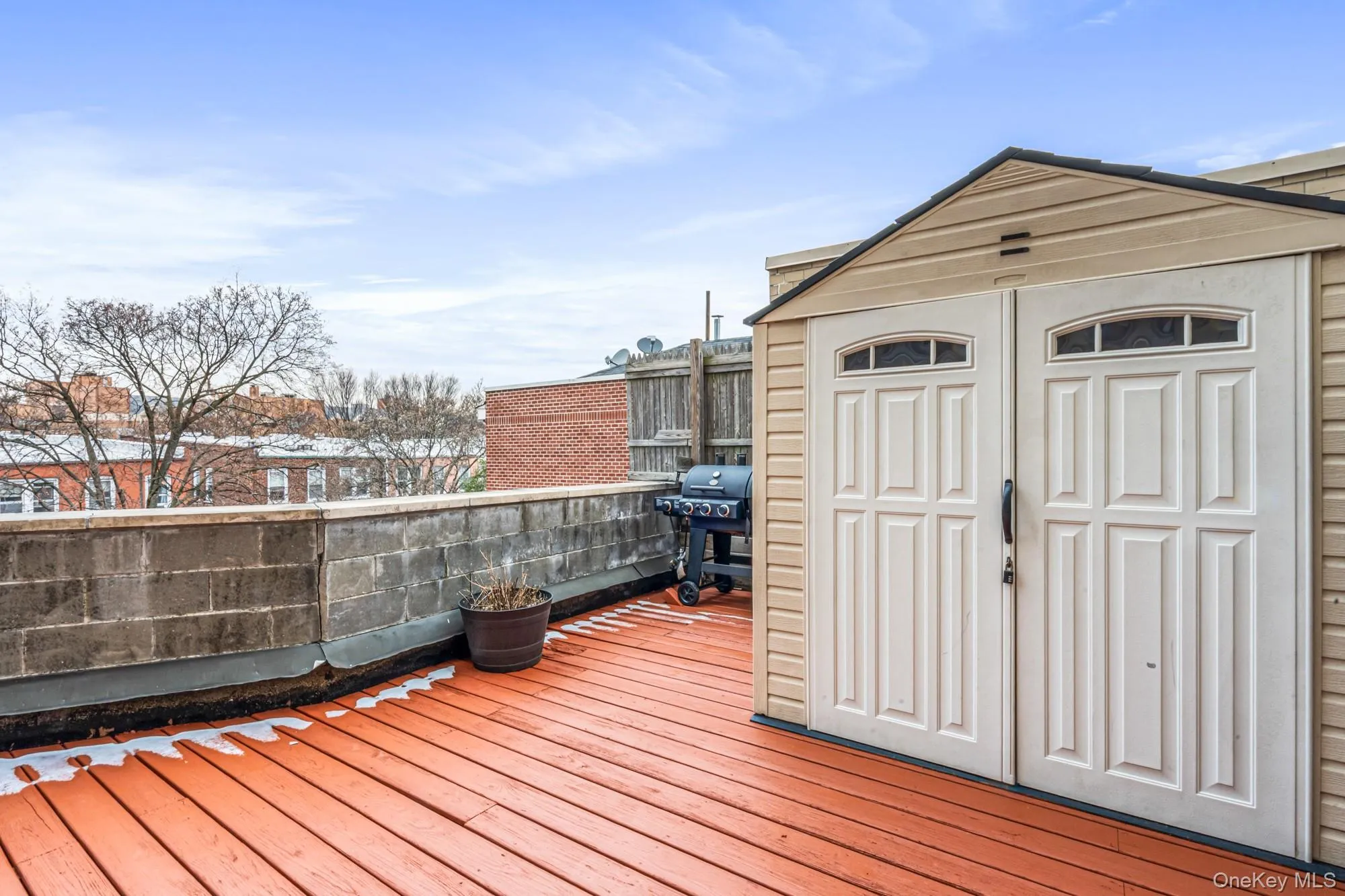 Wooden terrace with grilling area and a shed Wooden terrace with grilling area and a shed