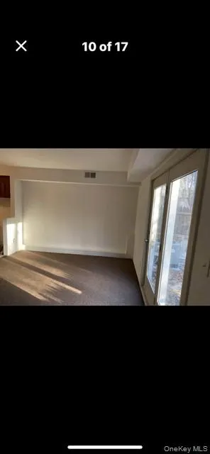 View of carpeted empty room View of carpeted empty room