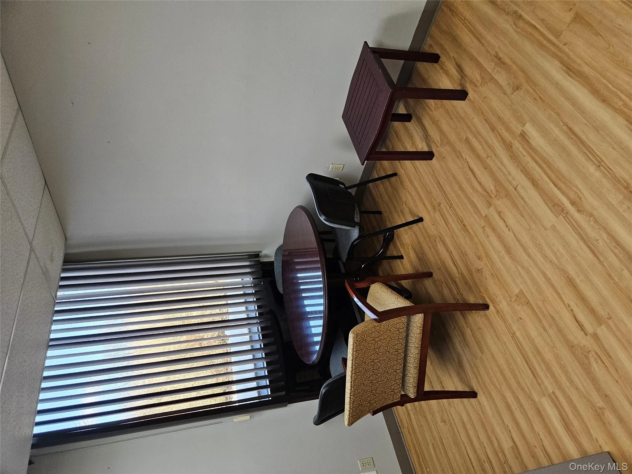 Sitting room featuring a paneled ceiling and light wood-style flooring Sitting room featuring a paneled ceiling and light wood-style flooring