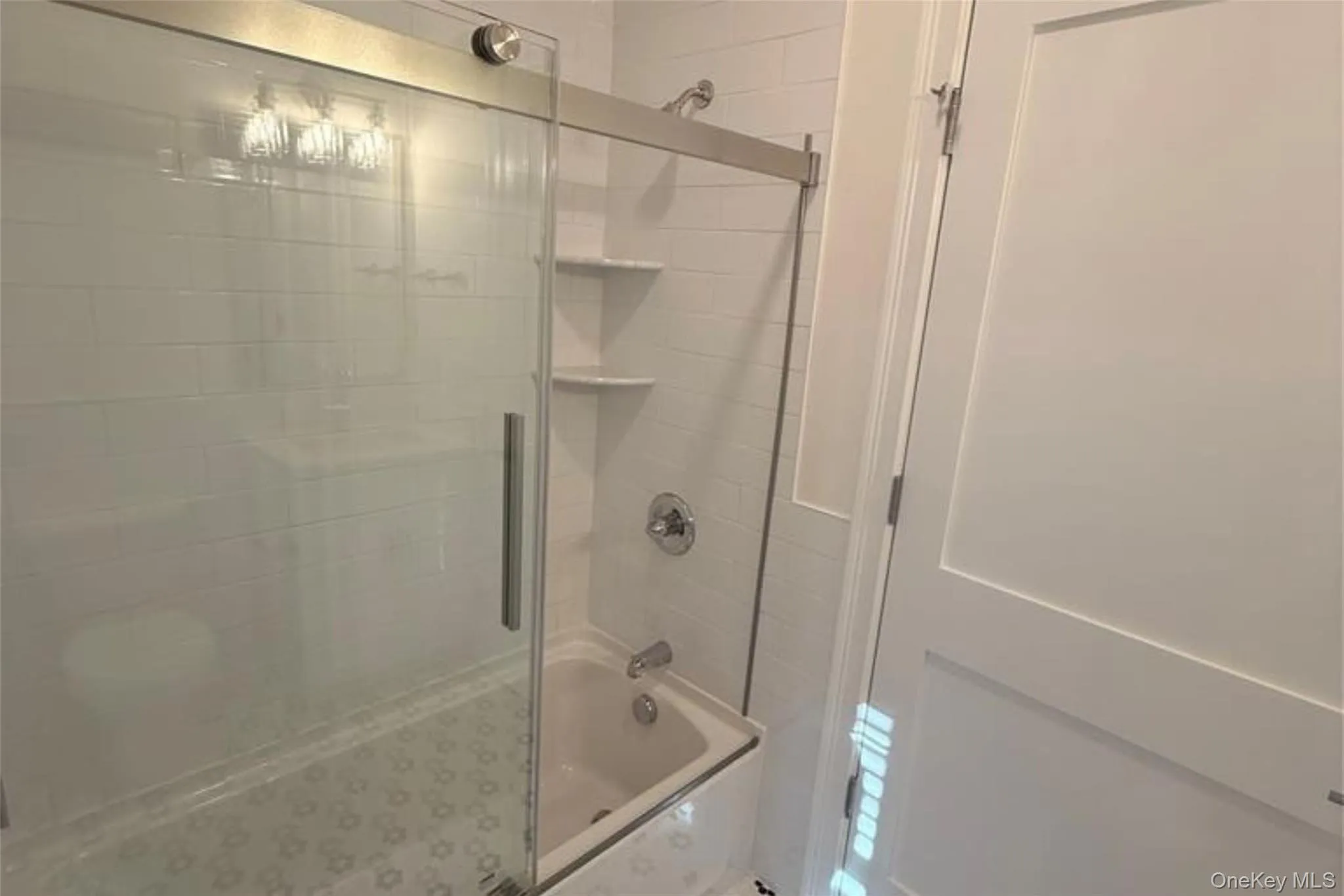 Full bathroom with shower / bath combination with glass door Full bathroom with shower / bath combination with glass door