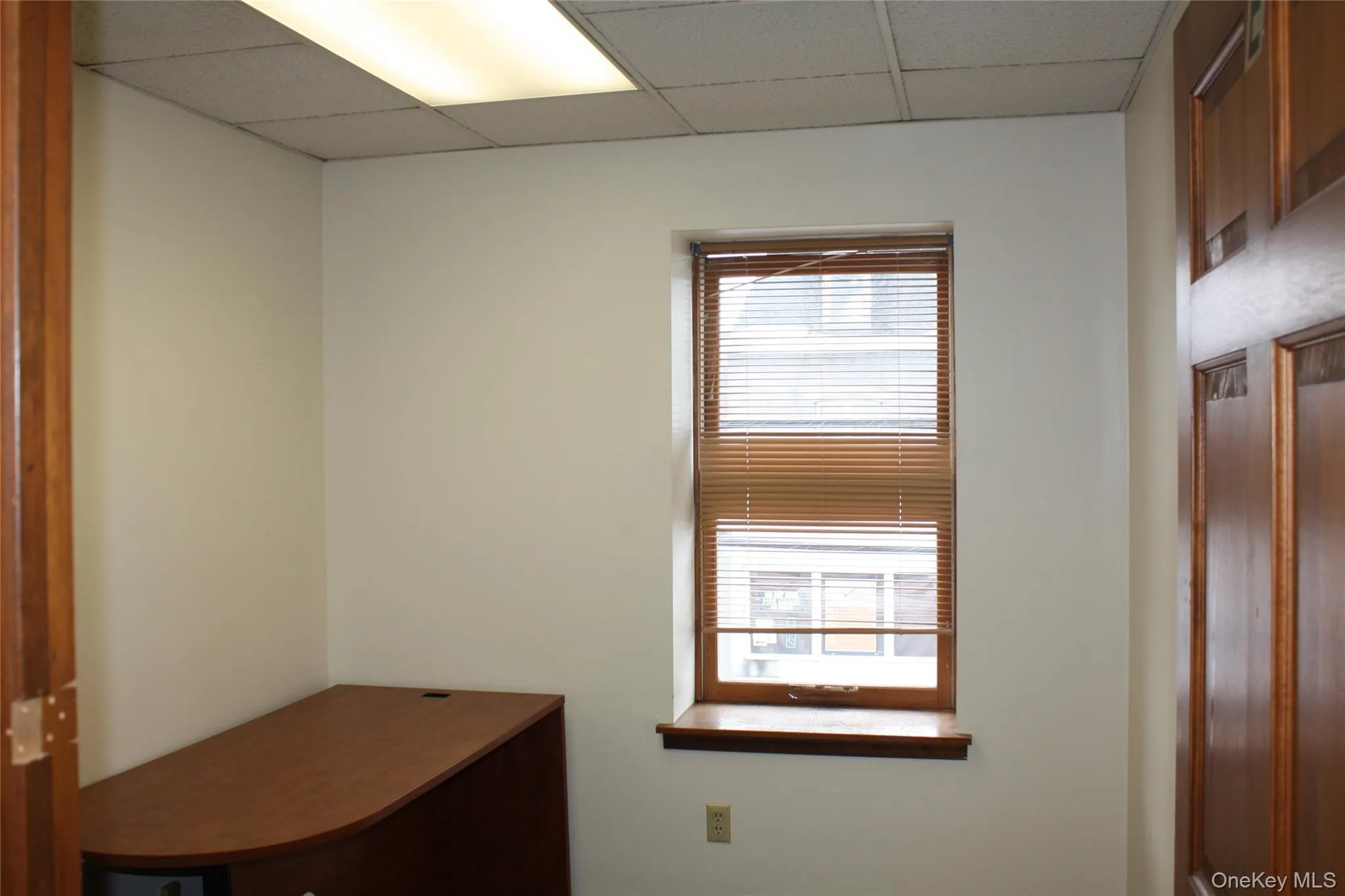 Unfurnished office featuring a drop ceiling Unfurnished office featuring a drop ceiling