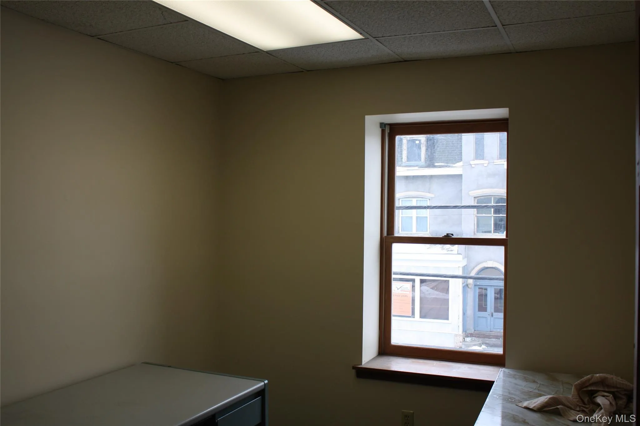 Laundry room with a paneled ceiling Laundry room with a paneled ceiling