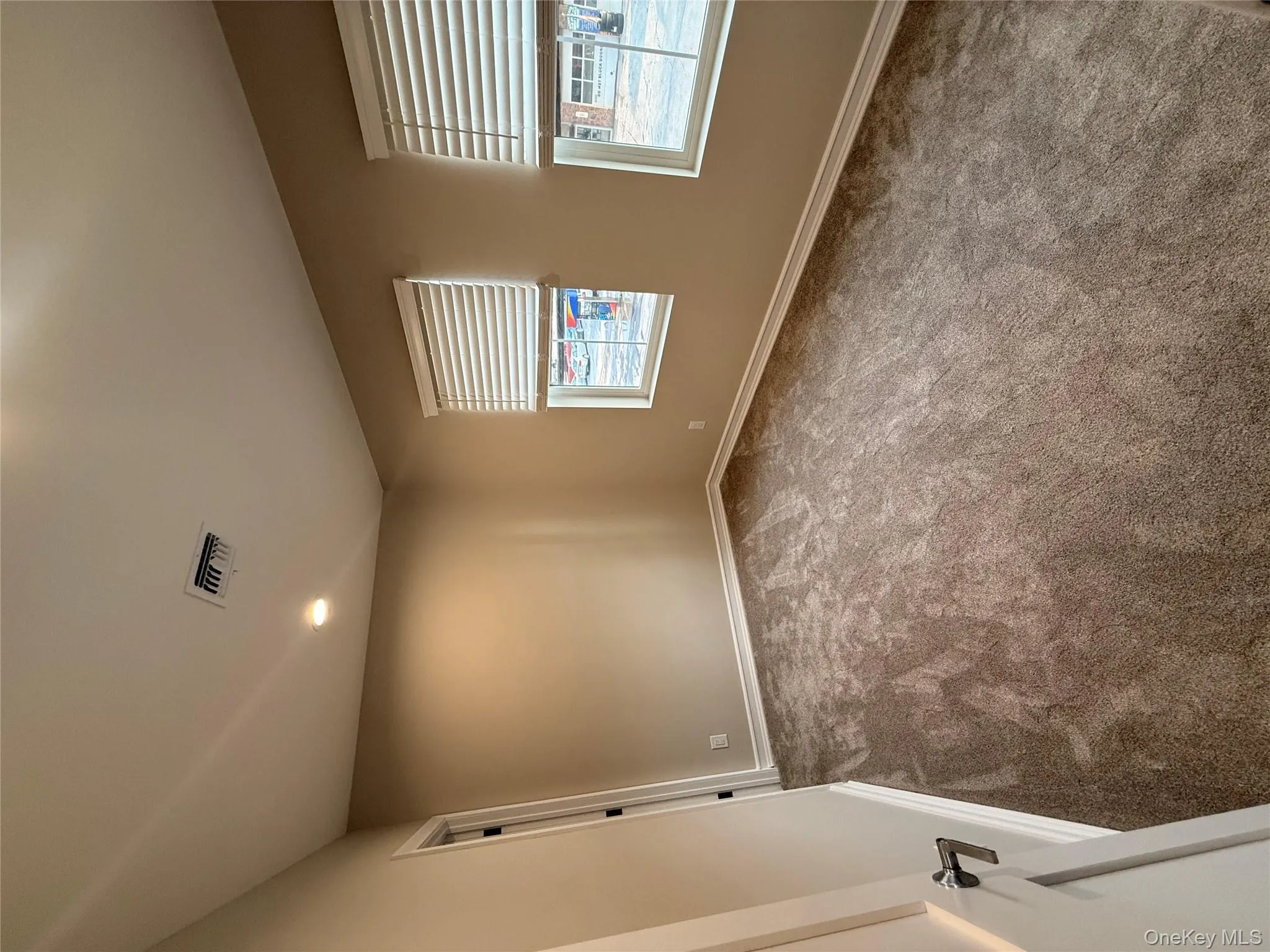 Empty room featuring carpet flooring and recessed lighting Empty room featuring carpet flooring and recessed lighting