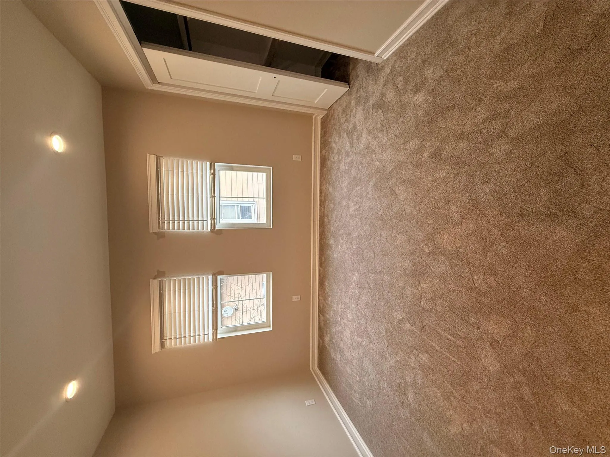 Unfurnished bedroom with recessed lighting, multiple windows, and carpet flooring Unfurnished bedroom with recessed lighting, multiple windows, and carpet flooring