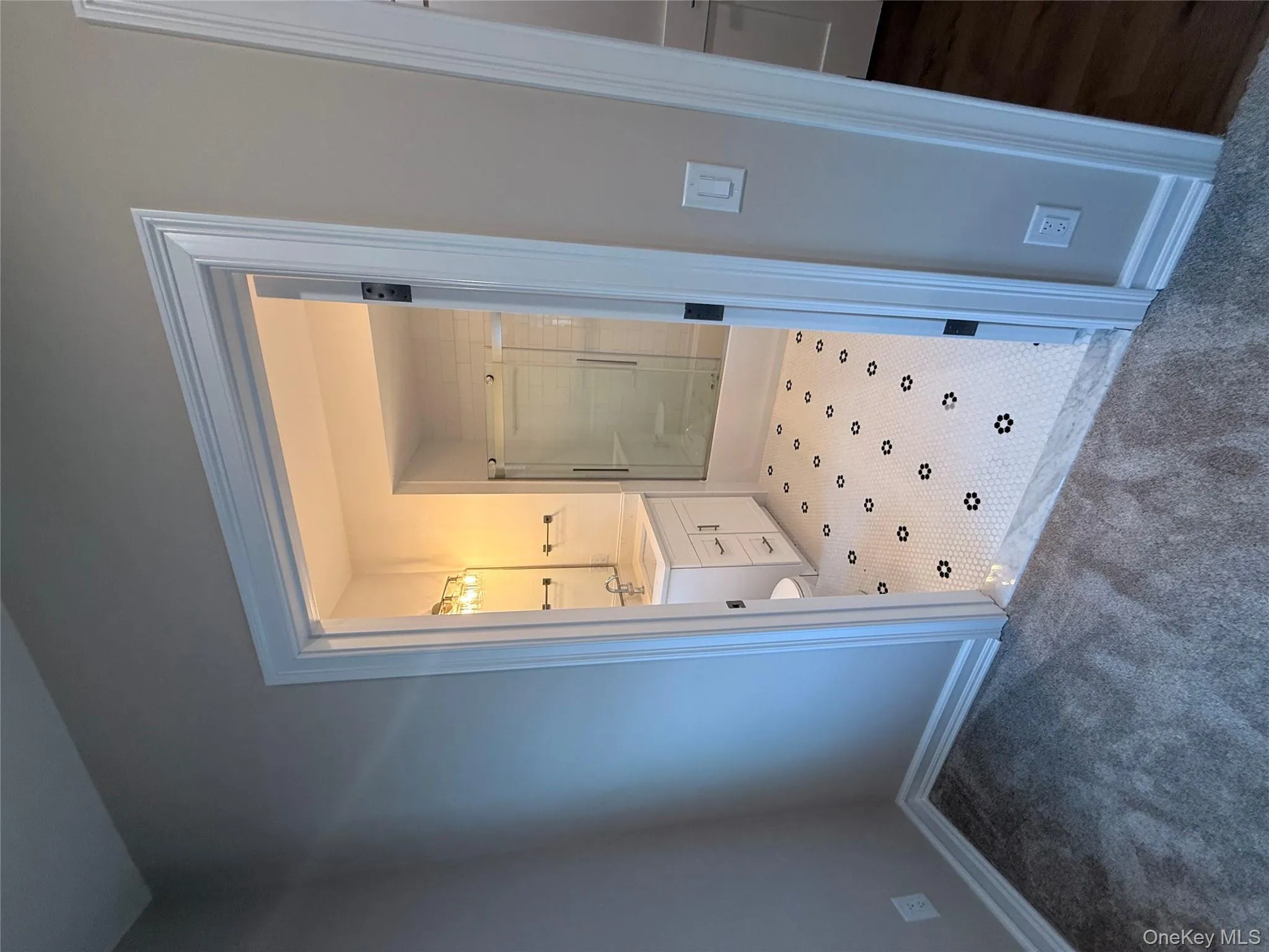 Full bath featuring a shower stall, vanity, and carpet Full bath featuring a shower stall, vanity, and carpet