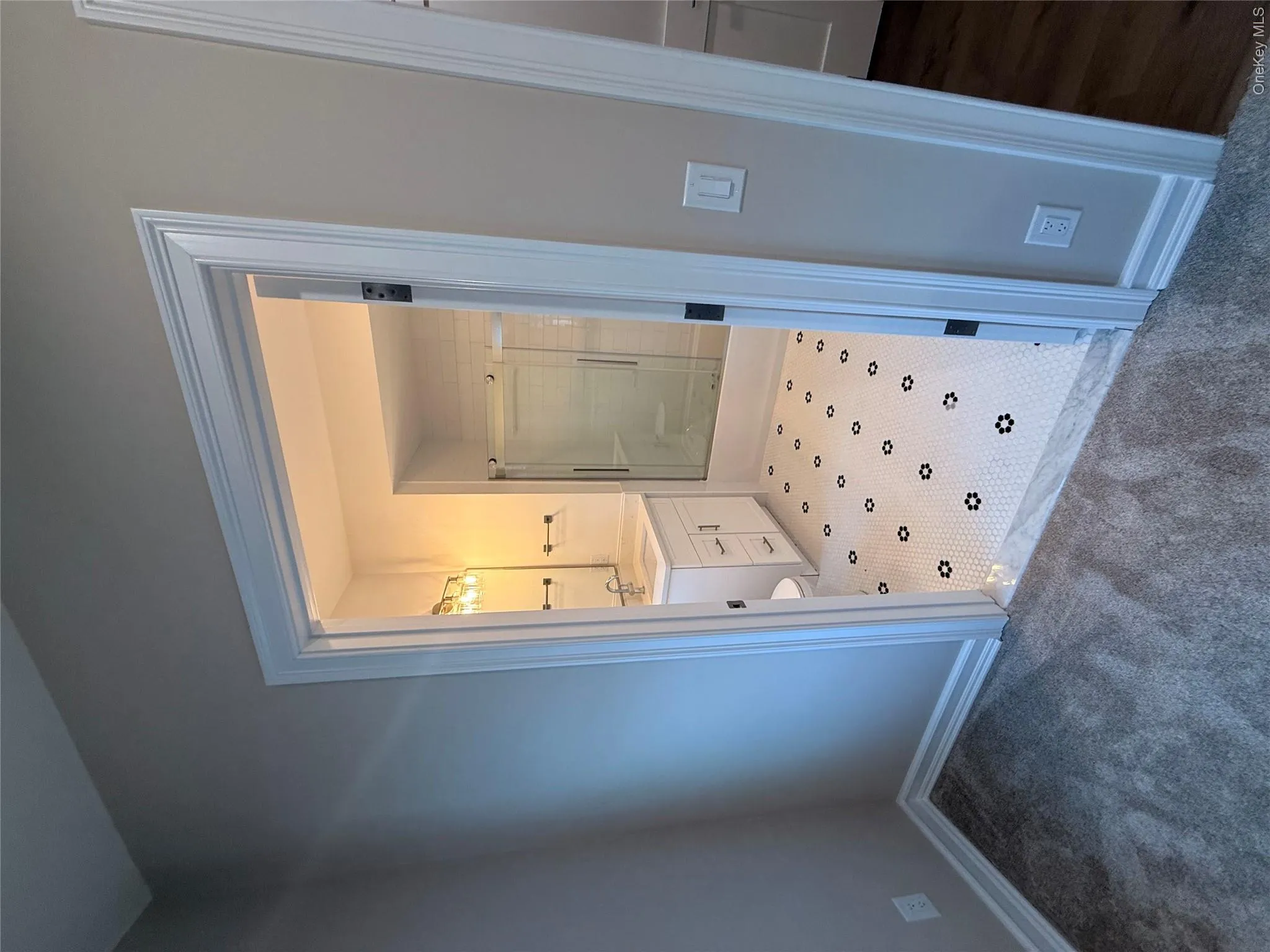 Full bath featuring a shower stall, vanity, and carpet Full bath featuring a shower stall, vanity, and carpet