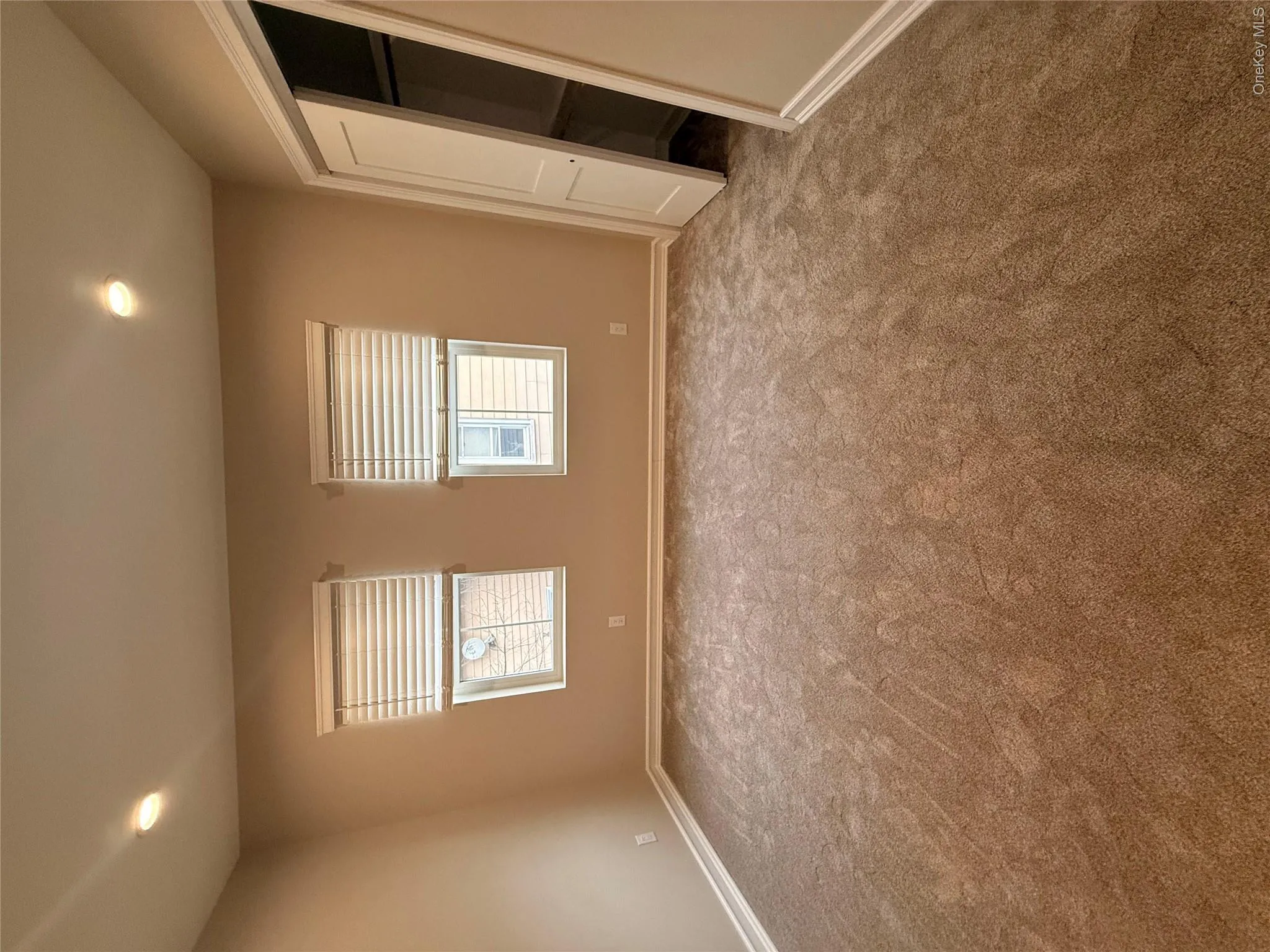 Unfurnished bedroom with recessed lighting, multiple windows, and carpet flooring Unfurnished bedroom with recessed lighting, multiple windows, and carpet flooring