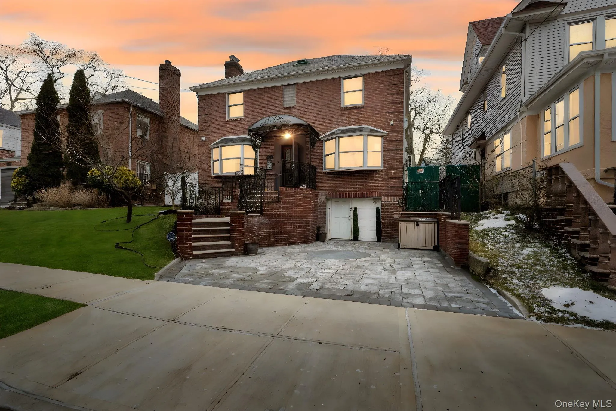 American foursquare style home with brick siding, a front yard, and a chimney American foursquare style home with brick siding, a front yard, and a chimney