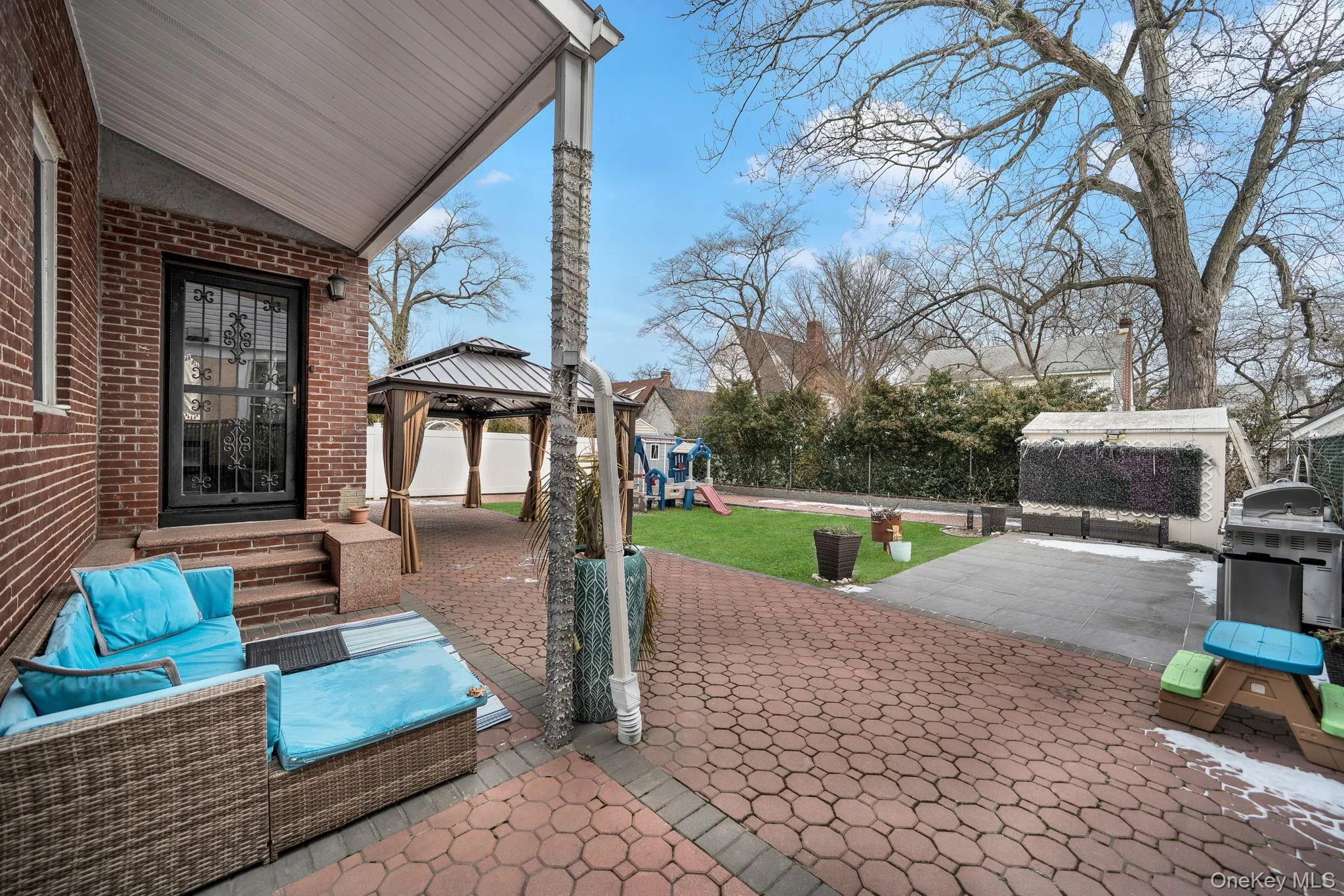 View of patio / terrace with a gazebo, a playground, area for grilling, an outdoor living space, and entry steps View of patio / terrace with a gazebo, a playground, area for grilling, an outdoor living space, and entry steps