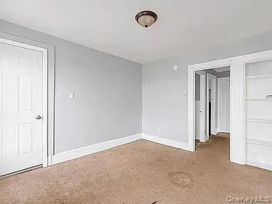 Unfurnished bedroom featuring baseboards Unfurnished bedroom featuring baseboards