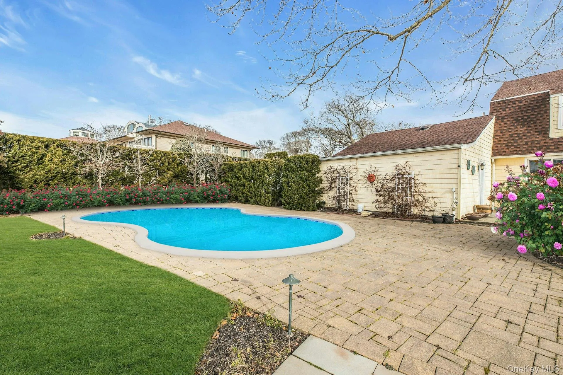 View of swimming pool with a yard and a patio area