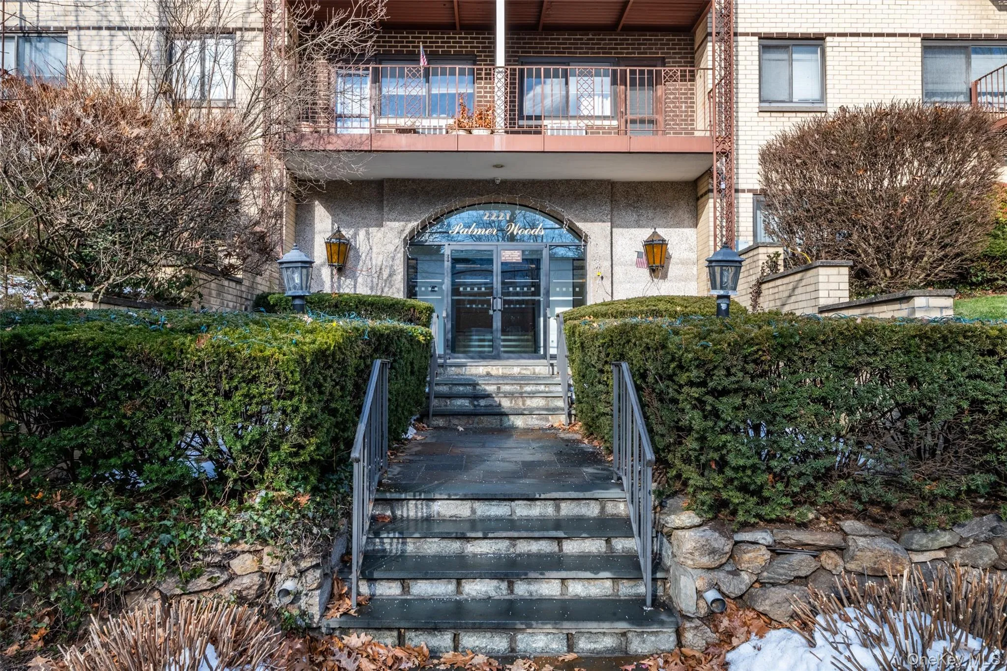 Doorway to property featuring stucco siding and brick siding Doorway to property featuring stucco siding and brick siding
