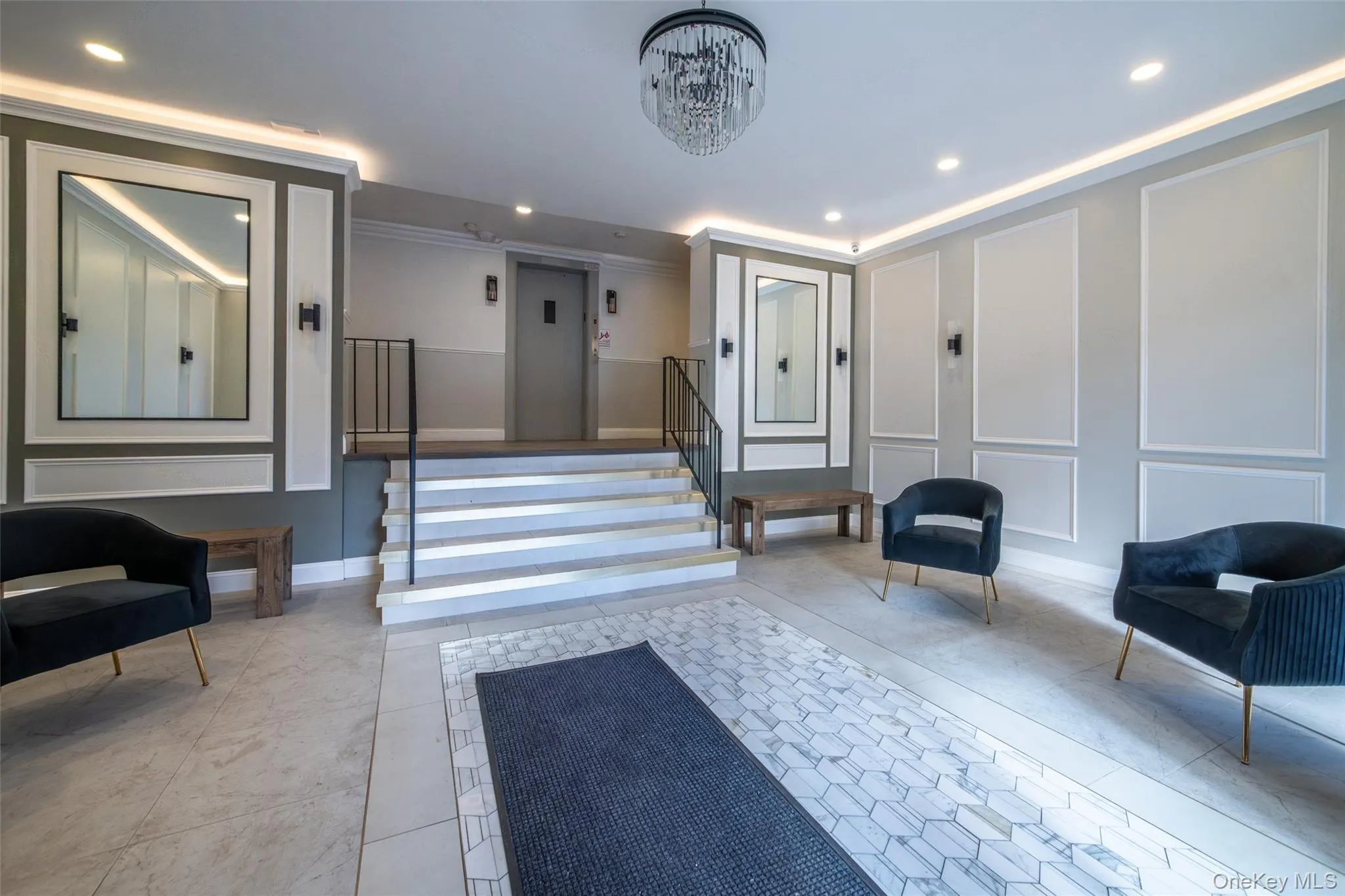 Lobby featuring a decorative wall, stairs, recessed lighting, and crown molding Lobby featuring a decorative wall, stairs, recessed lighting, and crown molding