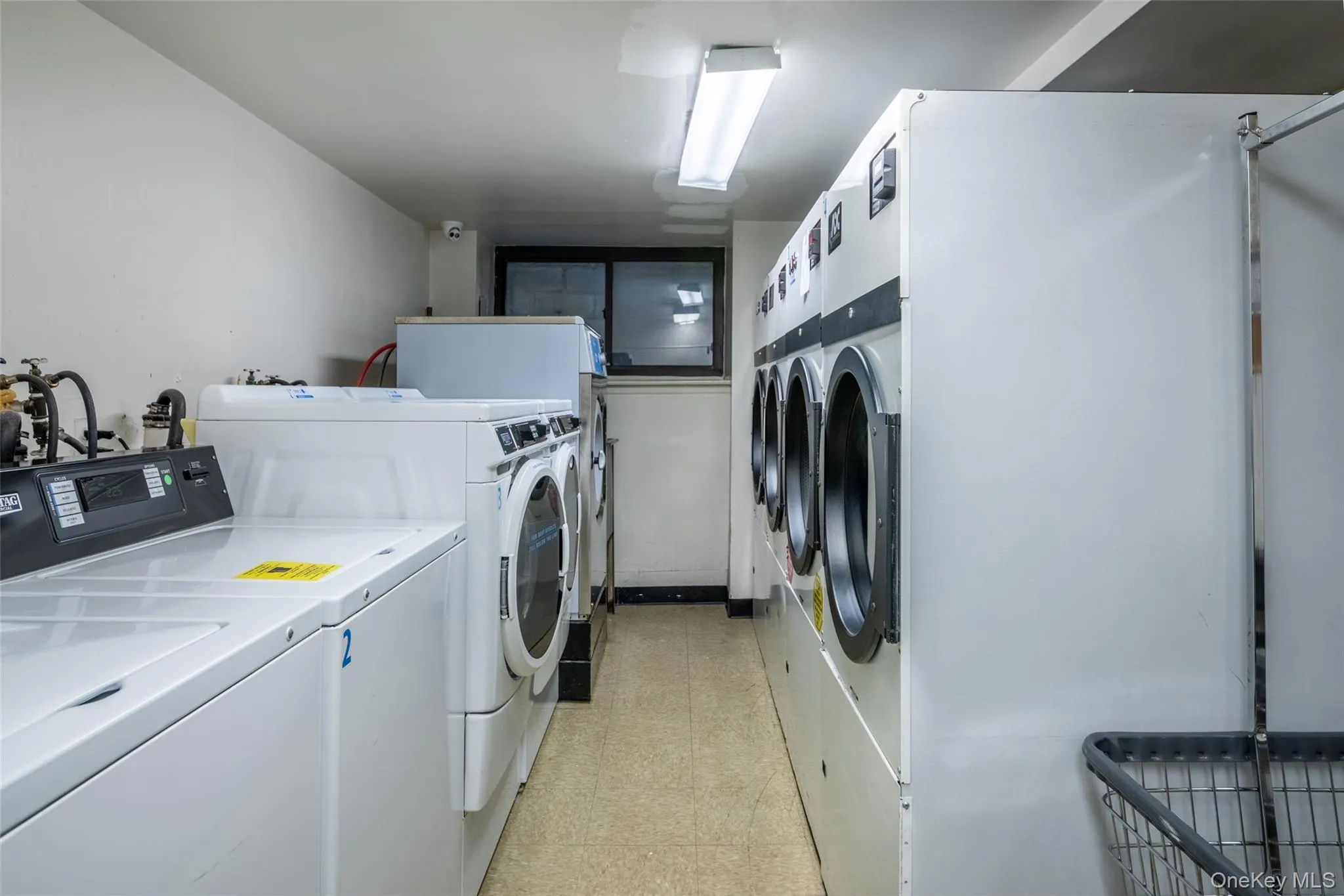 Community laundry with separate washer and dryer Community laundry with separate washer and dryer