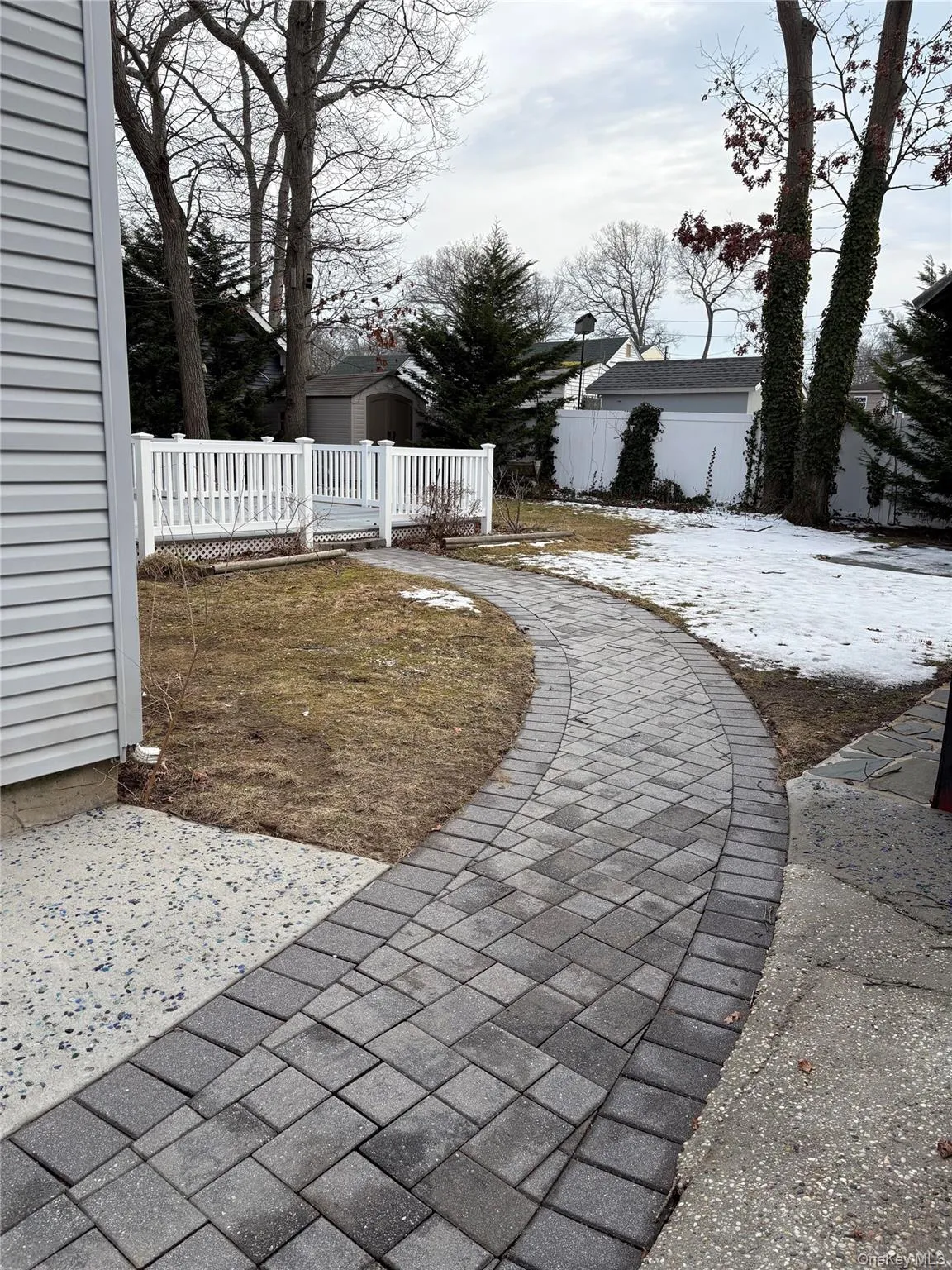 View of yard with a shed and a deck View of yard with a shed and a deck