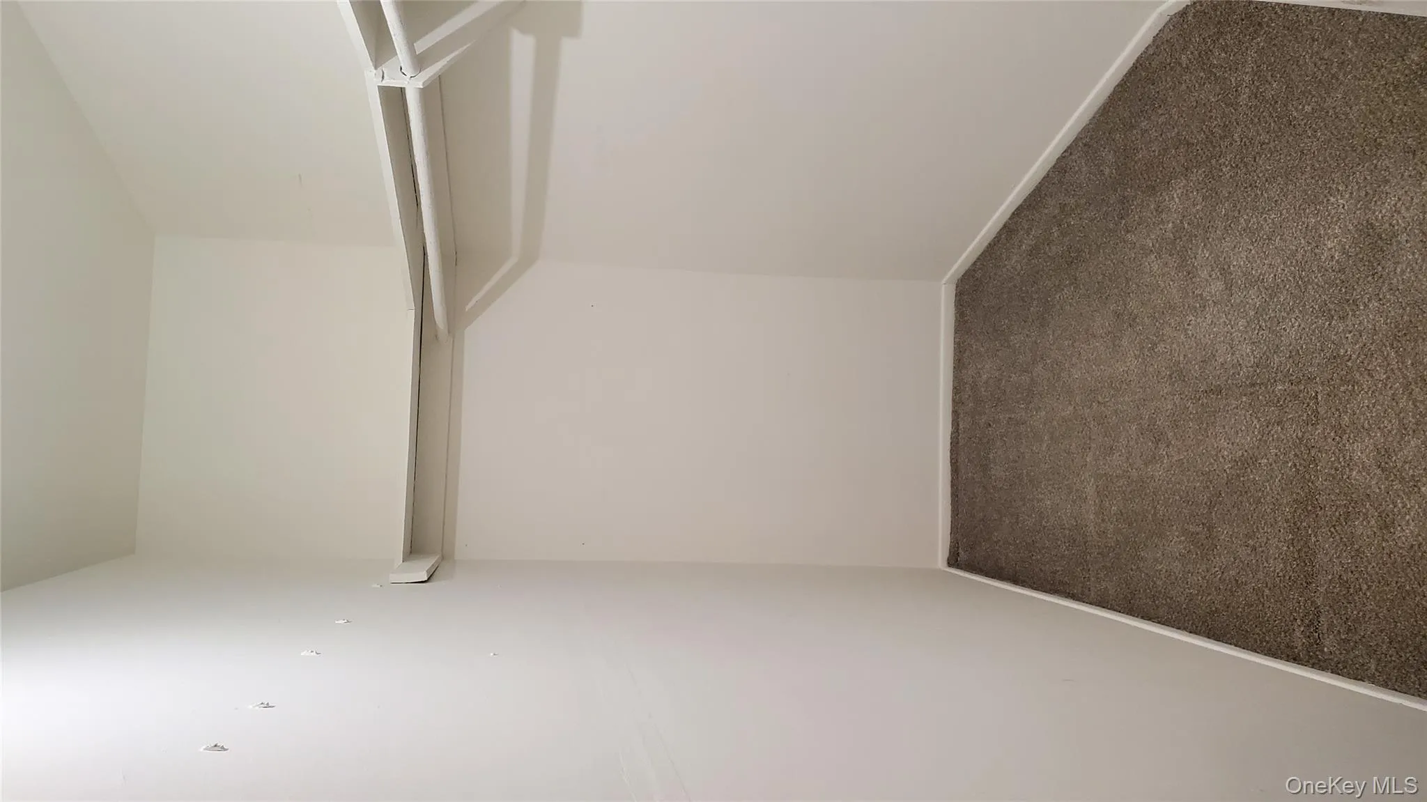 Spacious closet featuring dark colored carpet Spacious closet featuring dark colored carpet